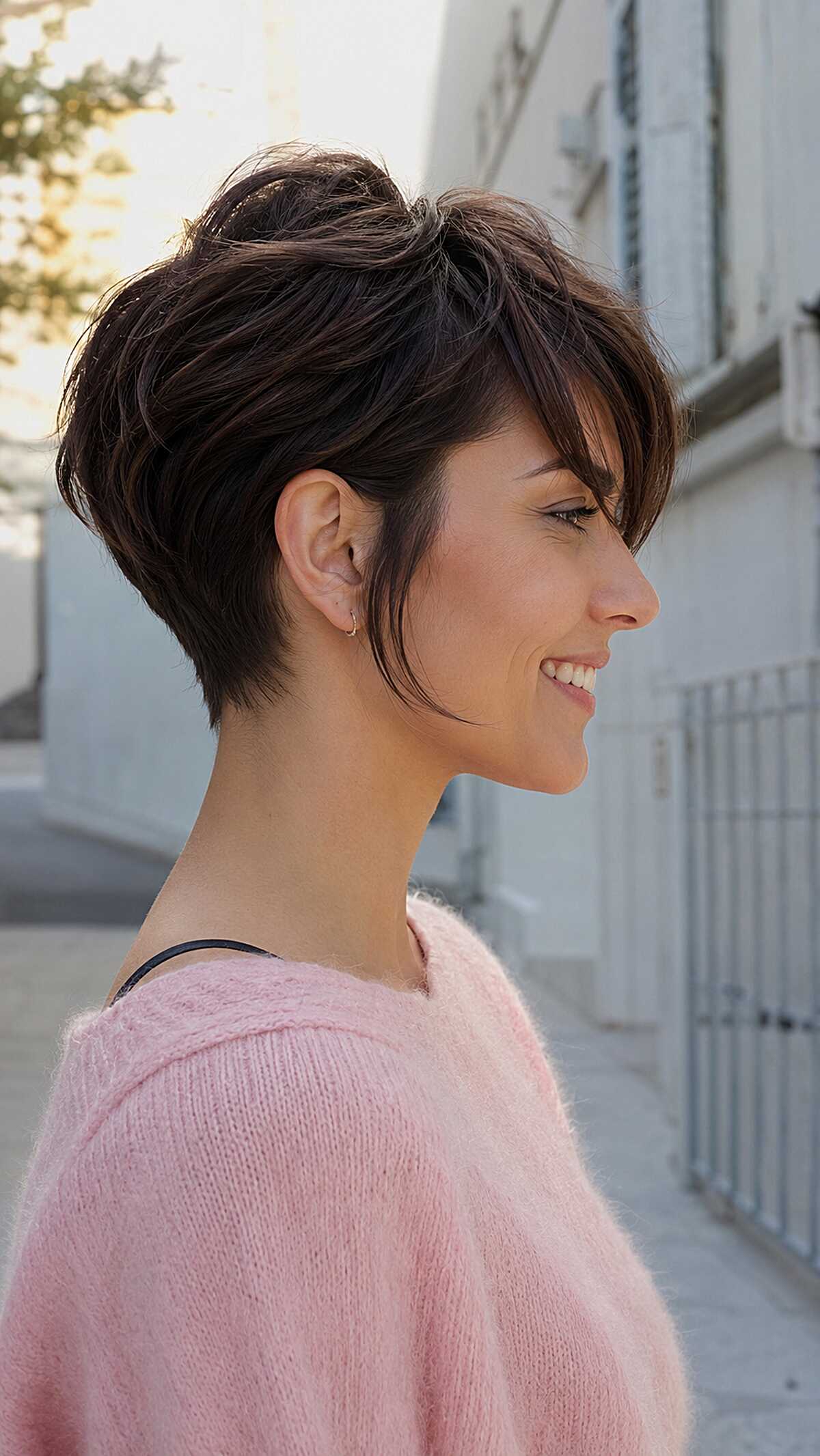 Voluminous brunette angled pixie with soft long fringe