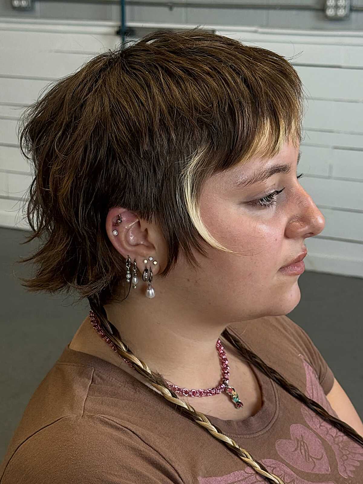 Warm brown textured shaggy bob with blonde face frame