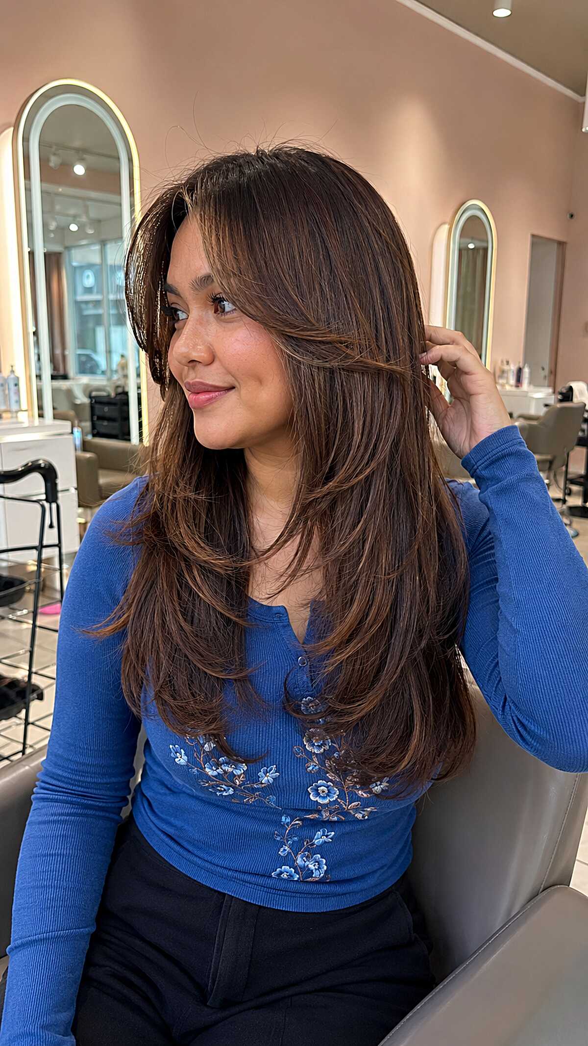 Warm chestnut brown long blowout with flipped ends
