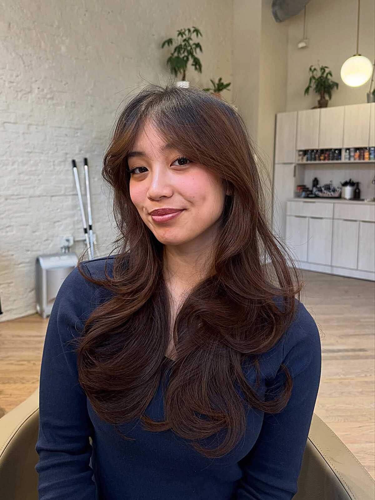 Long warm chocolate brown hush cut with blown-out curls