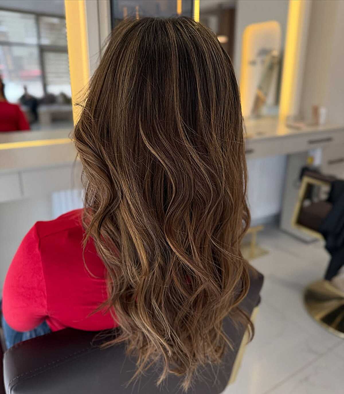 Long dark brunette waves with ashy babylights at ends