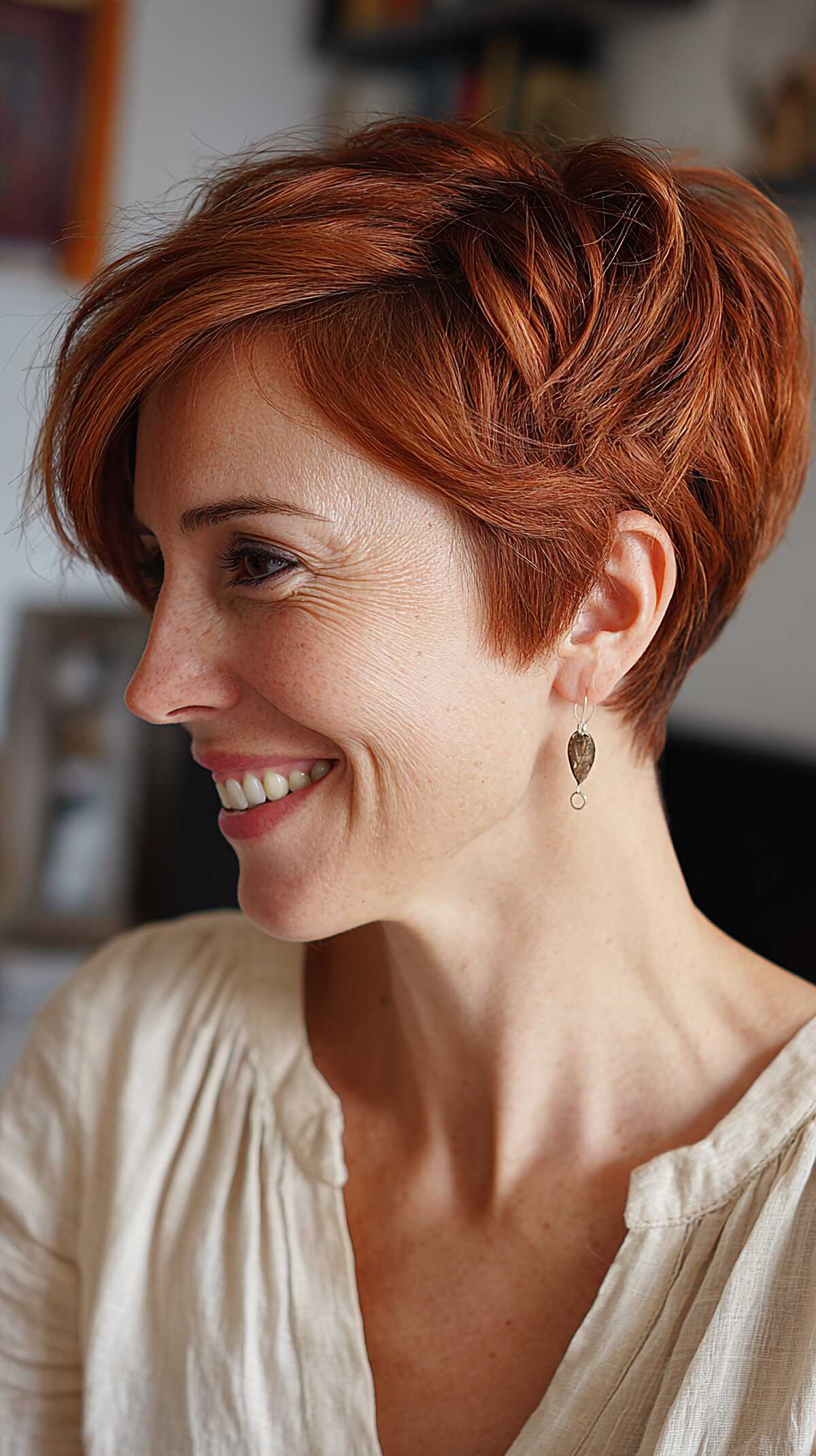 Warm copper angled pixie with feathered layers and volume