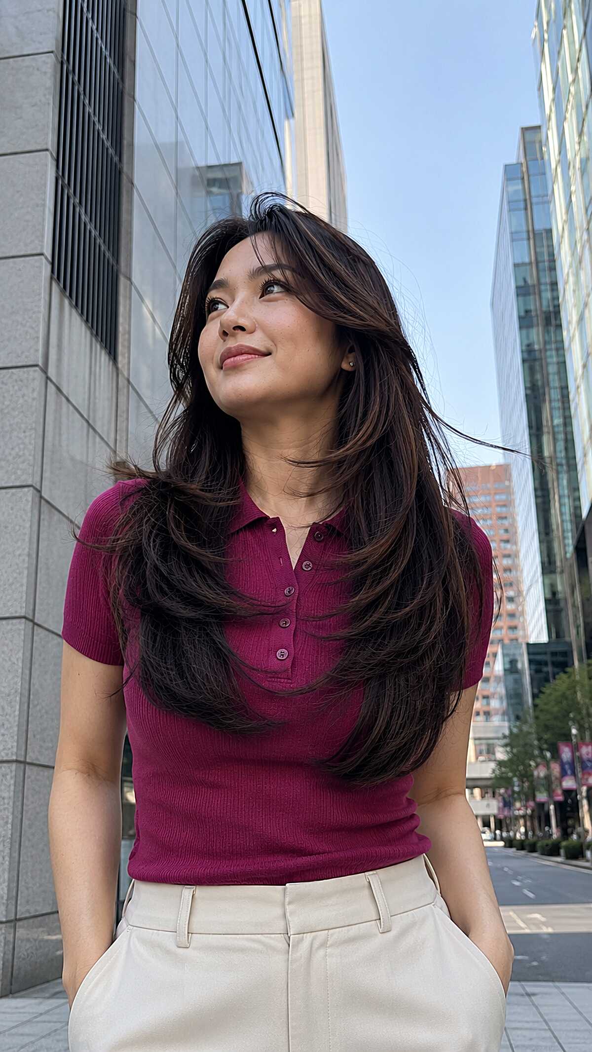 Windswept long layered dark hair with curtain bangs