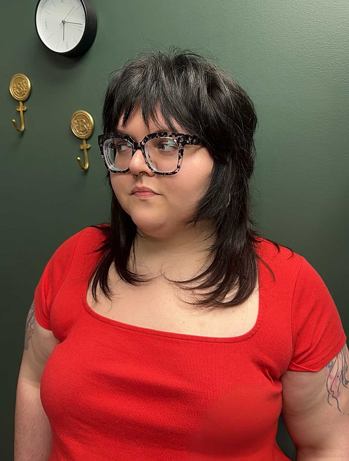 Medium dark brown shag with wispy bangs and feathered layers