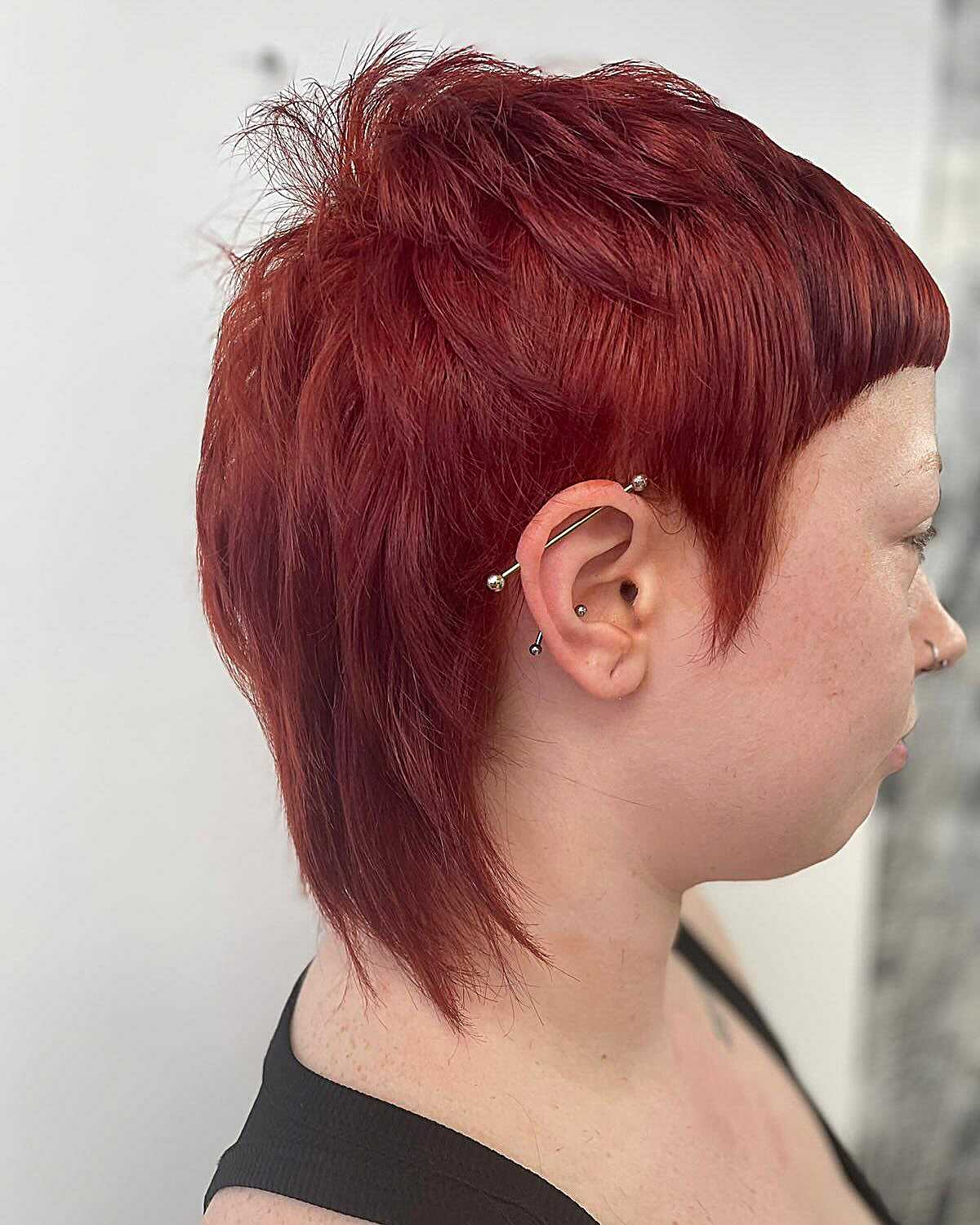 Short textured pixie in deep crimson red