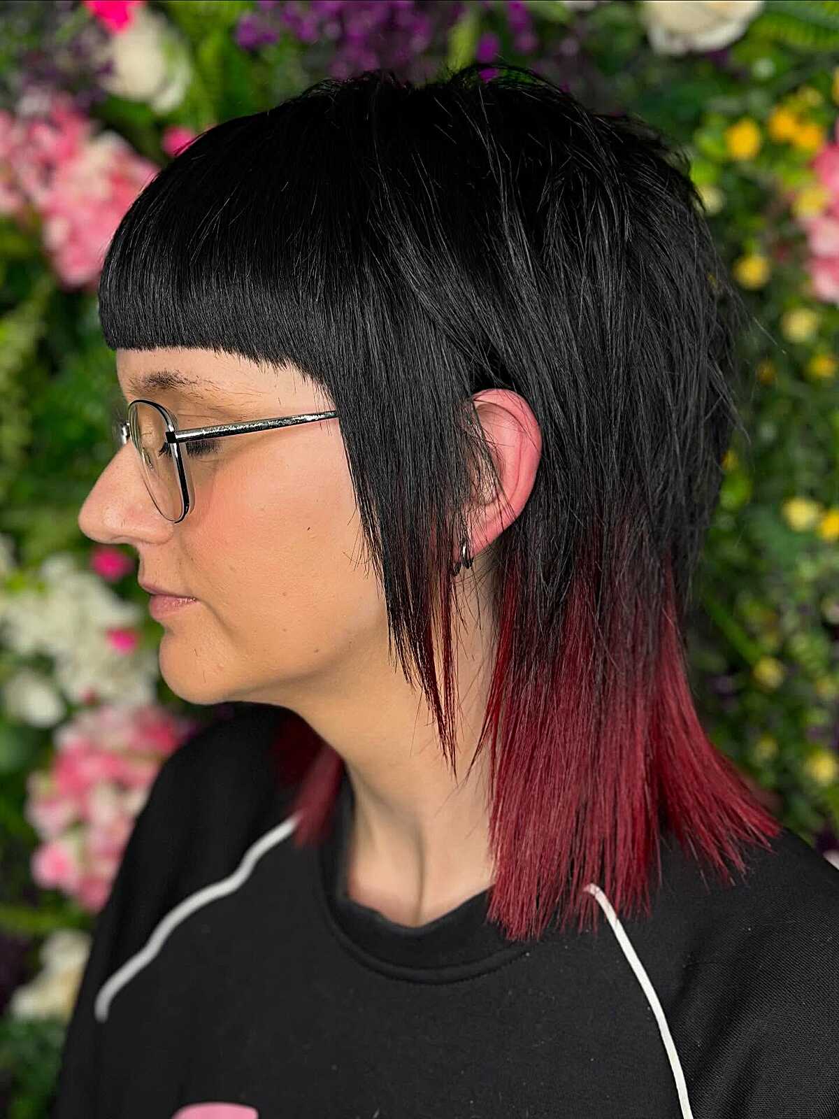 Black bob with micro bangs and red-dipped ends