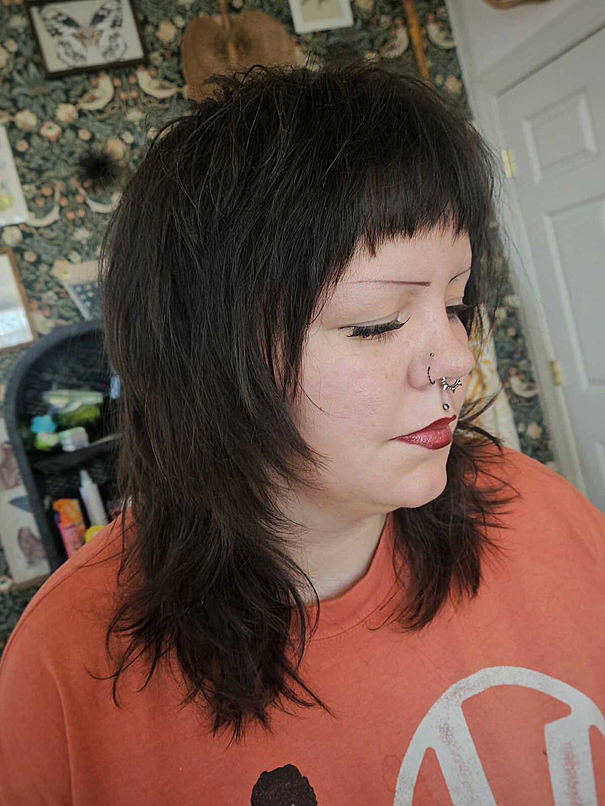 Dark brown choppy shag with short baby bangs
