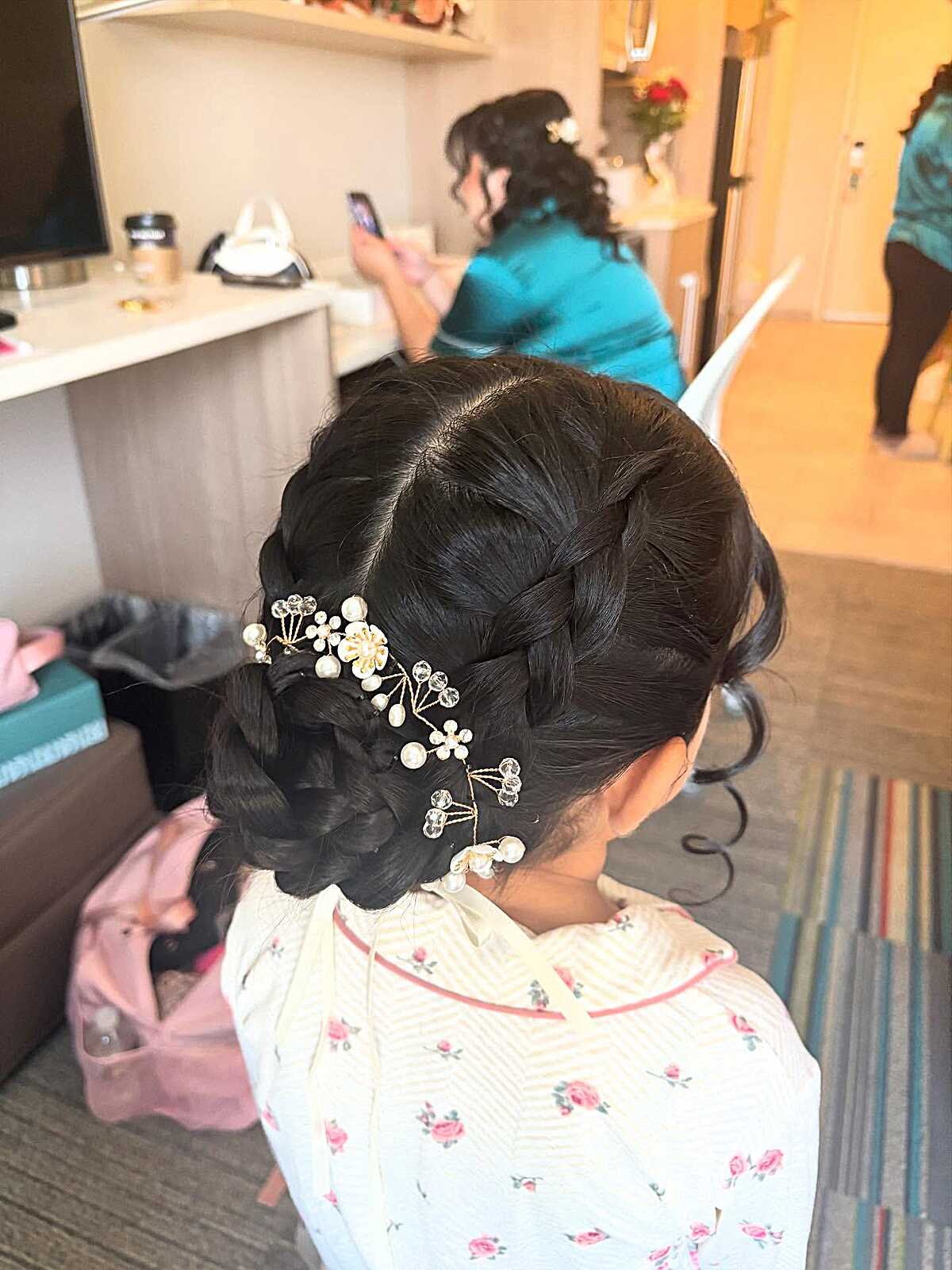 Braided low bun with pearl and crystal floral hair pins
