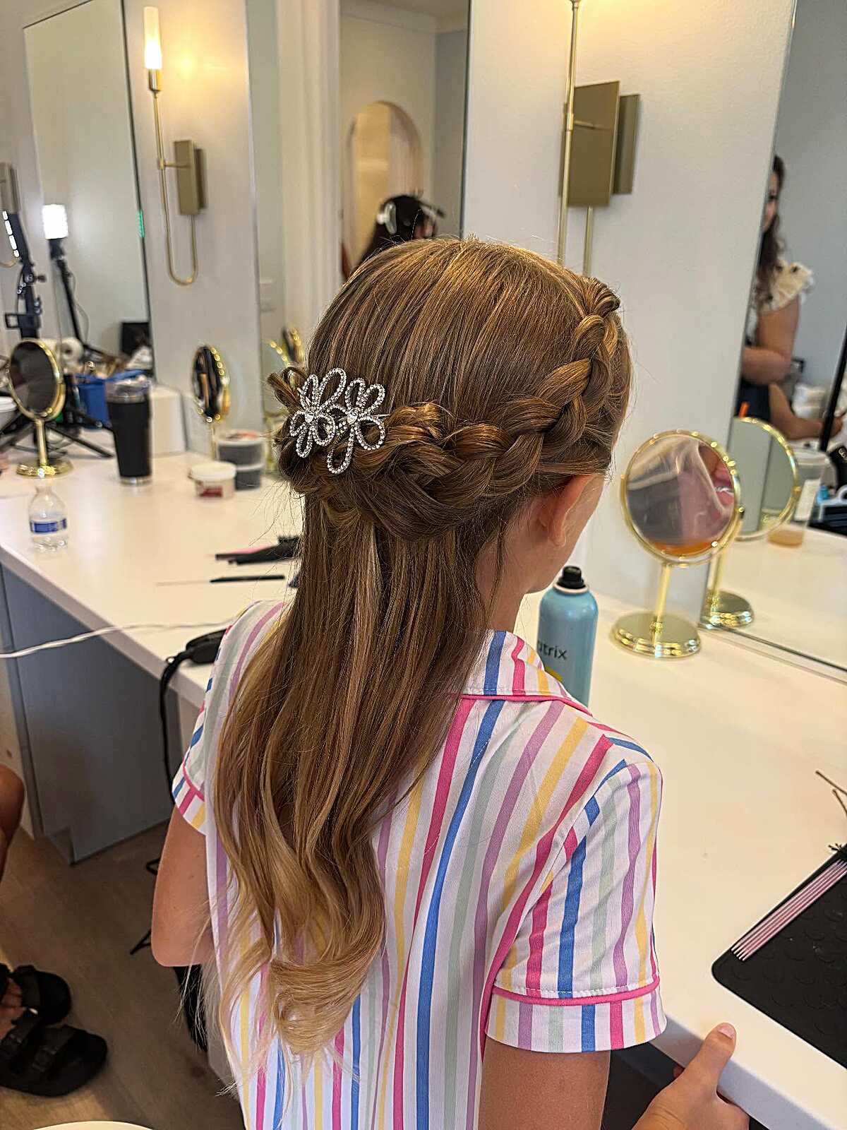 Half-down braid with rhinestone butterfly hair clip