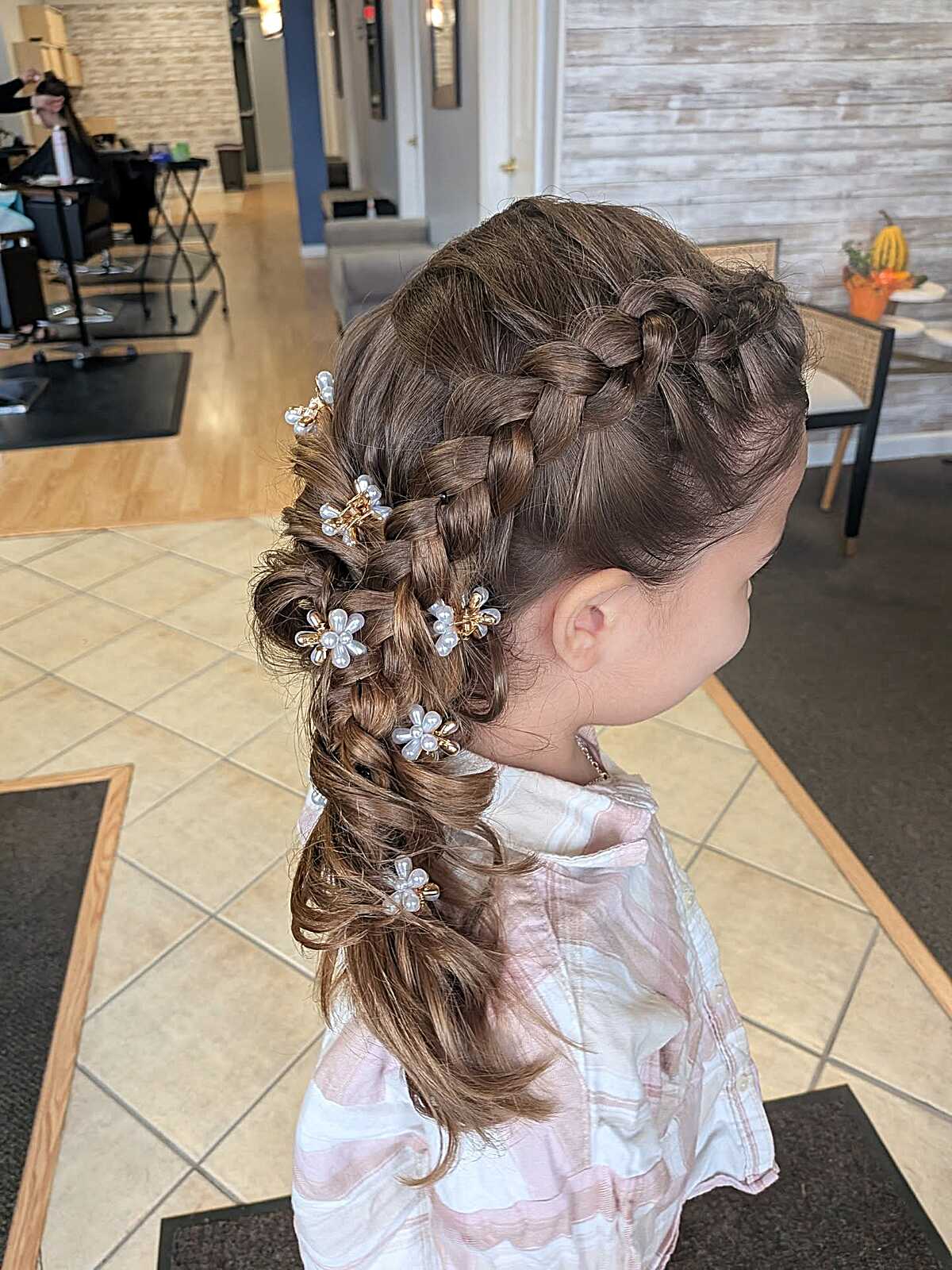 Double Dutch braids with scattered pearl flower clips