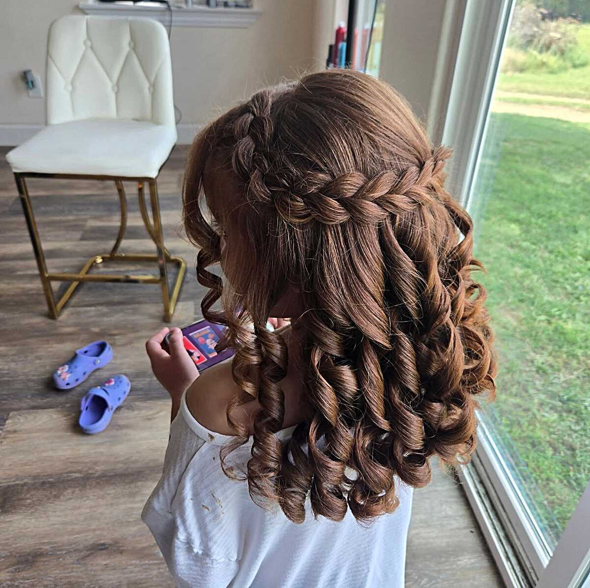 Dutch braid half-up with tight spiral curls cascading