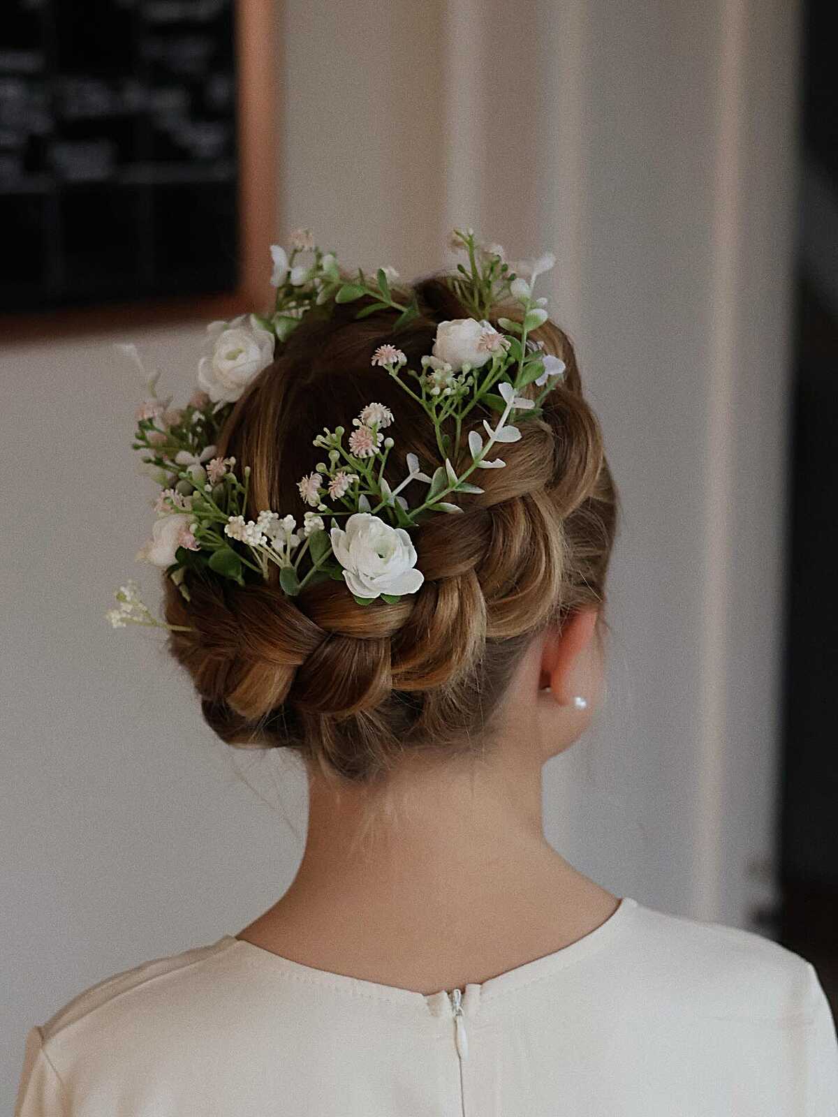 Halo braid updo with fresh white and pink flowers