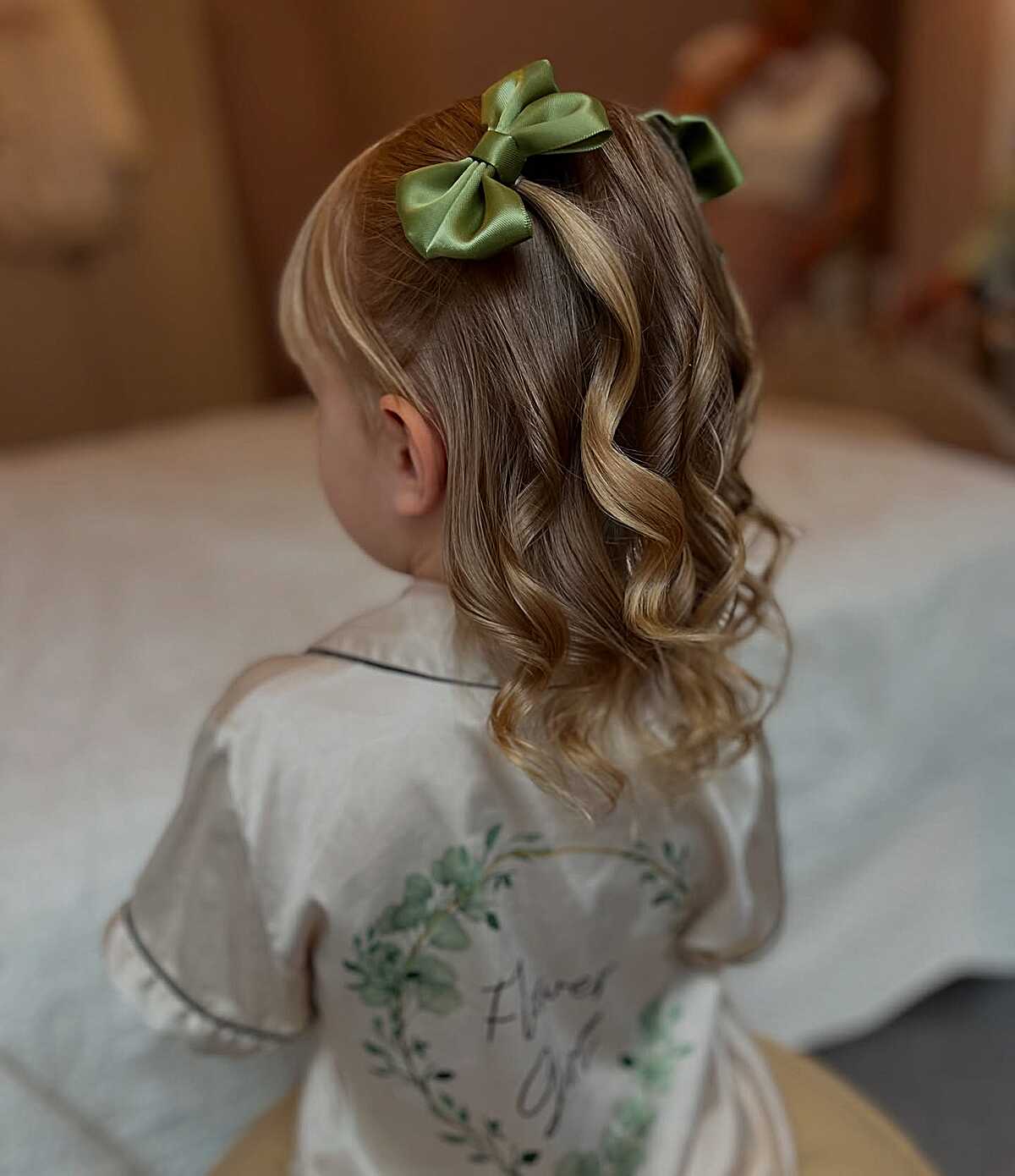 Short curled hair with olive green satin bow clip