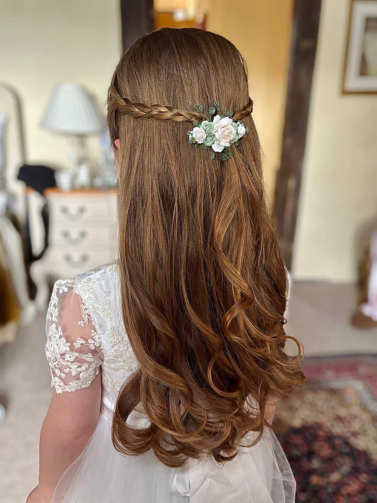 Long straight half-up hair with braid and flower clip