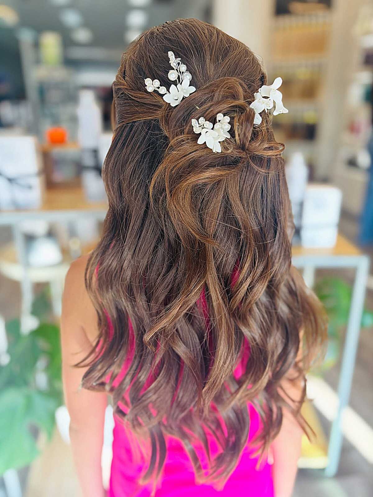 Soft wave half-up twist with white floral hair pins
