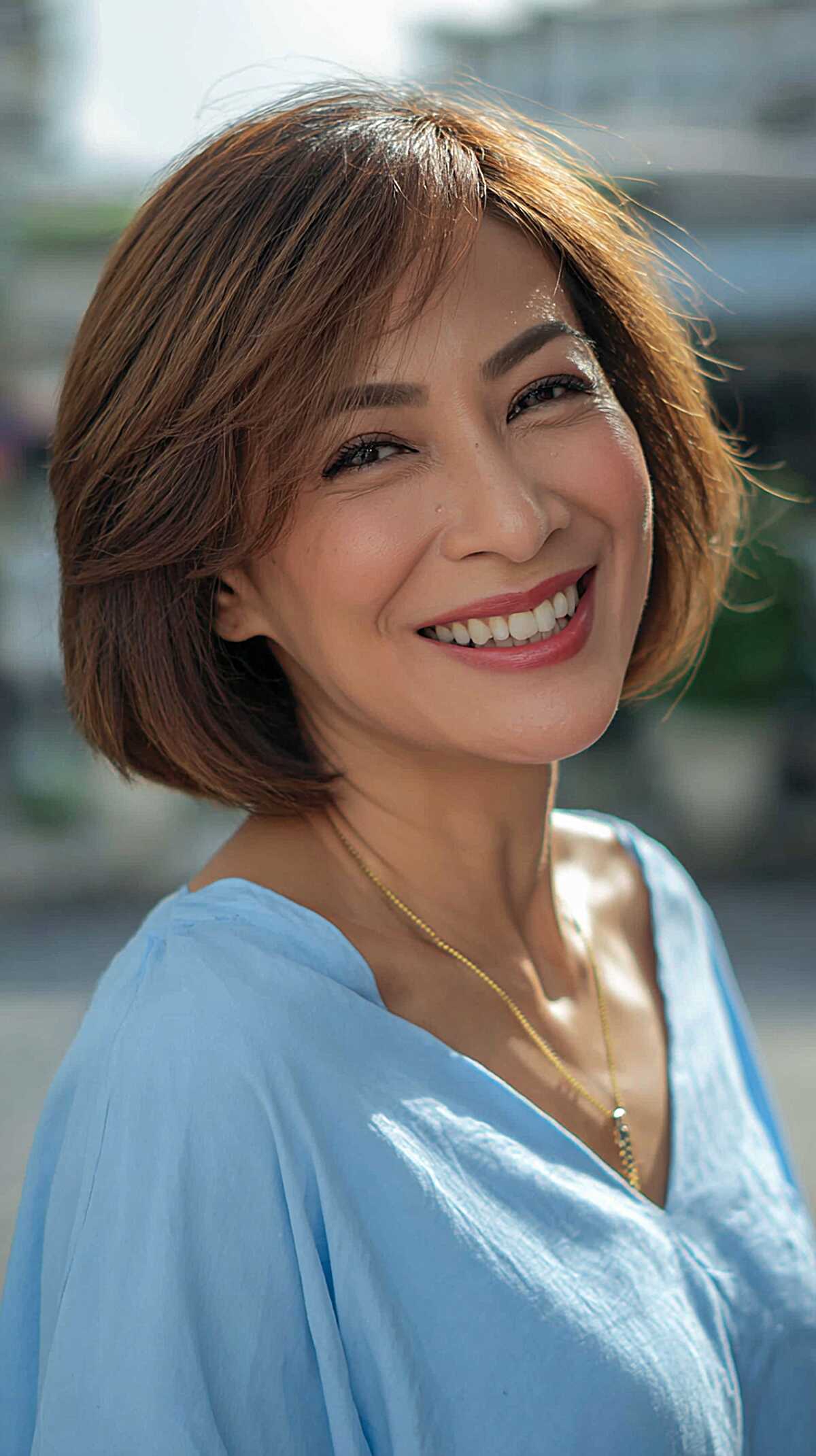 Warm Brunette Layered Chin-Length Bob with Side Sweep