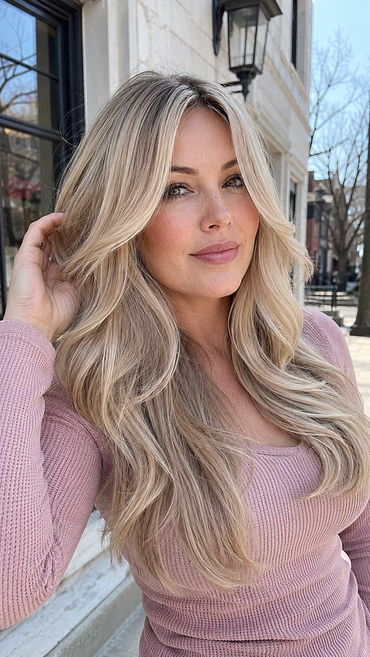 Long buttery blonde waves with curtain face-framing layers