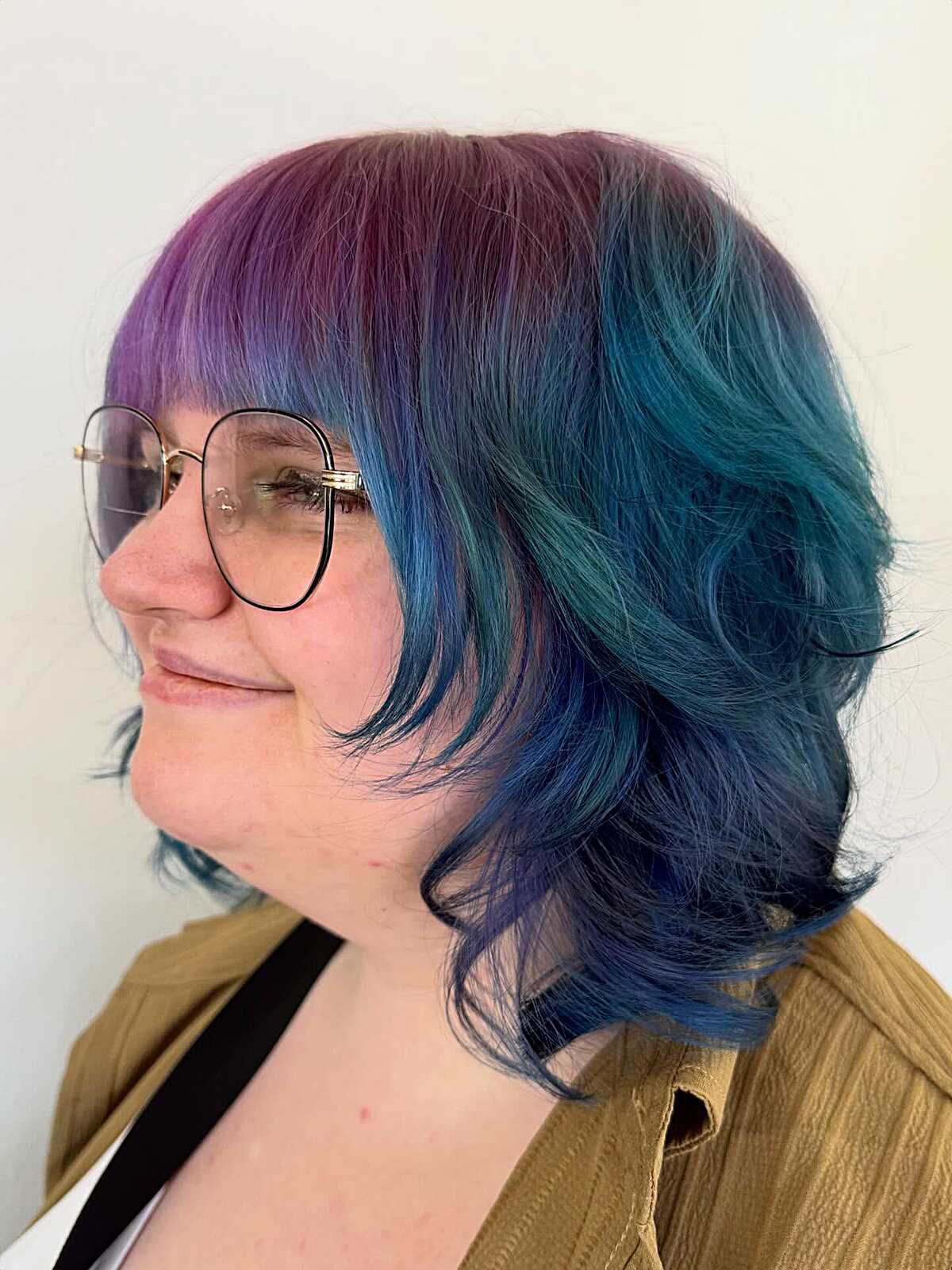 Bob with purple roots fading to teal ends and bangs