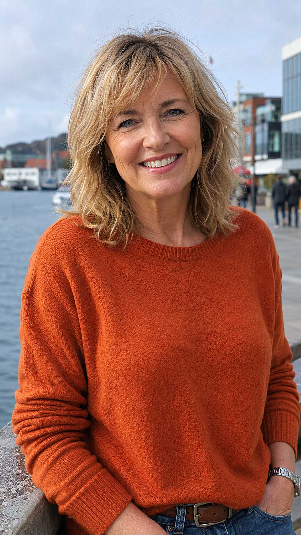 Sandy blonde shoulder-length shag with choppy fringe