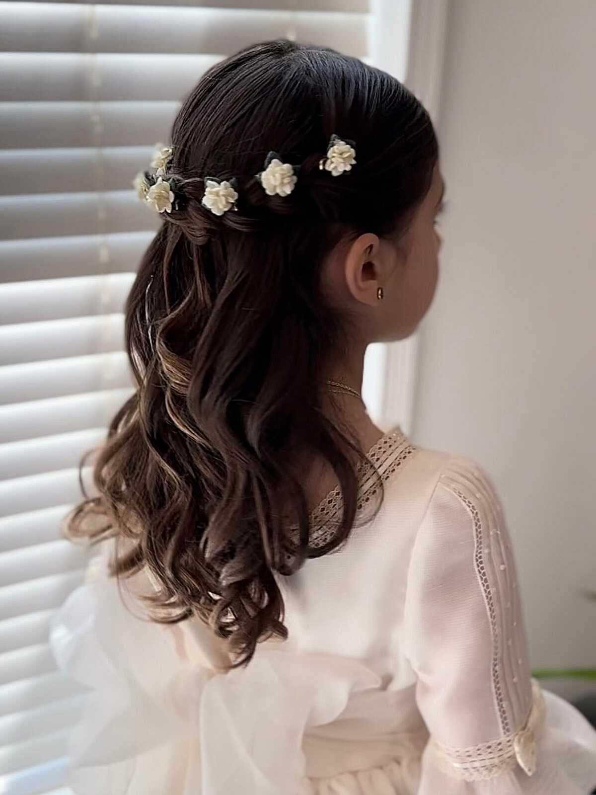 Soft half-up waves with small ivory floral garland at crown