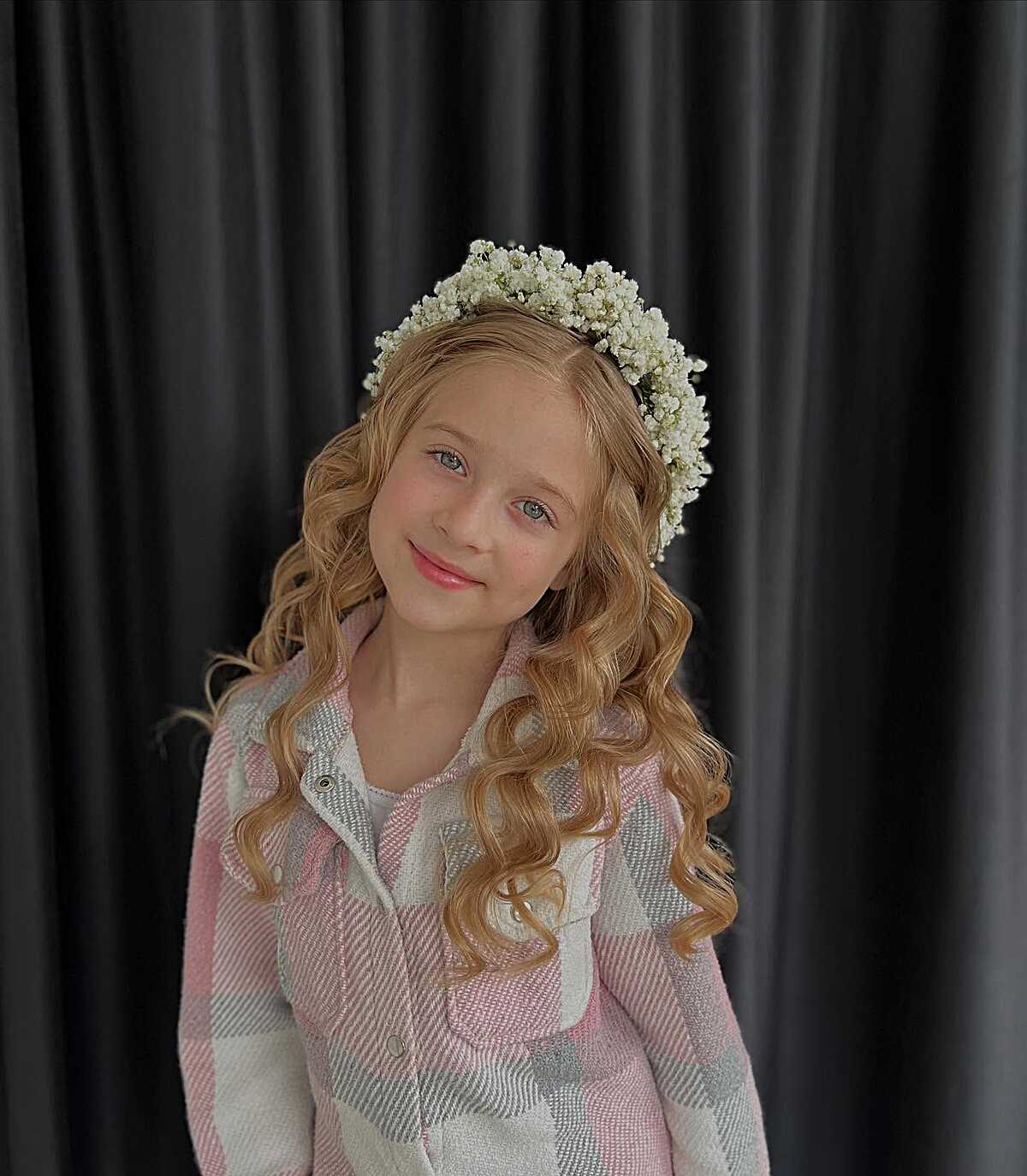 Strawberry blonde curls with full baby's breath flower crown