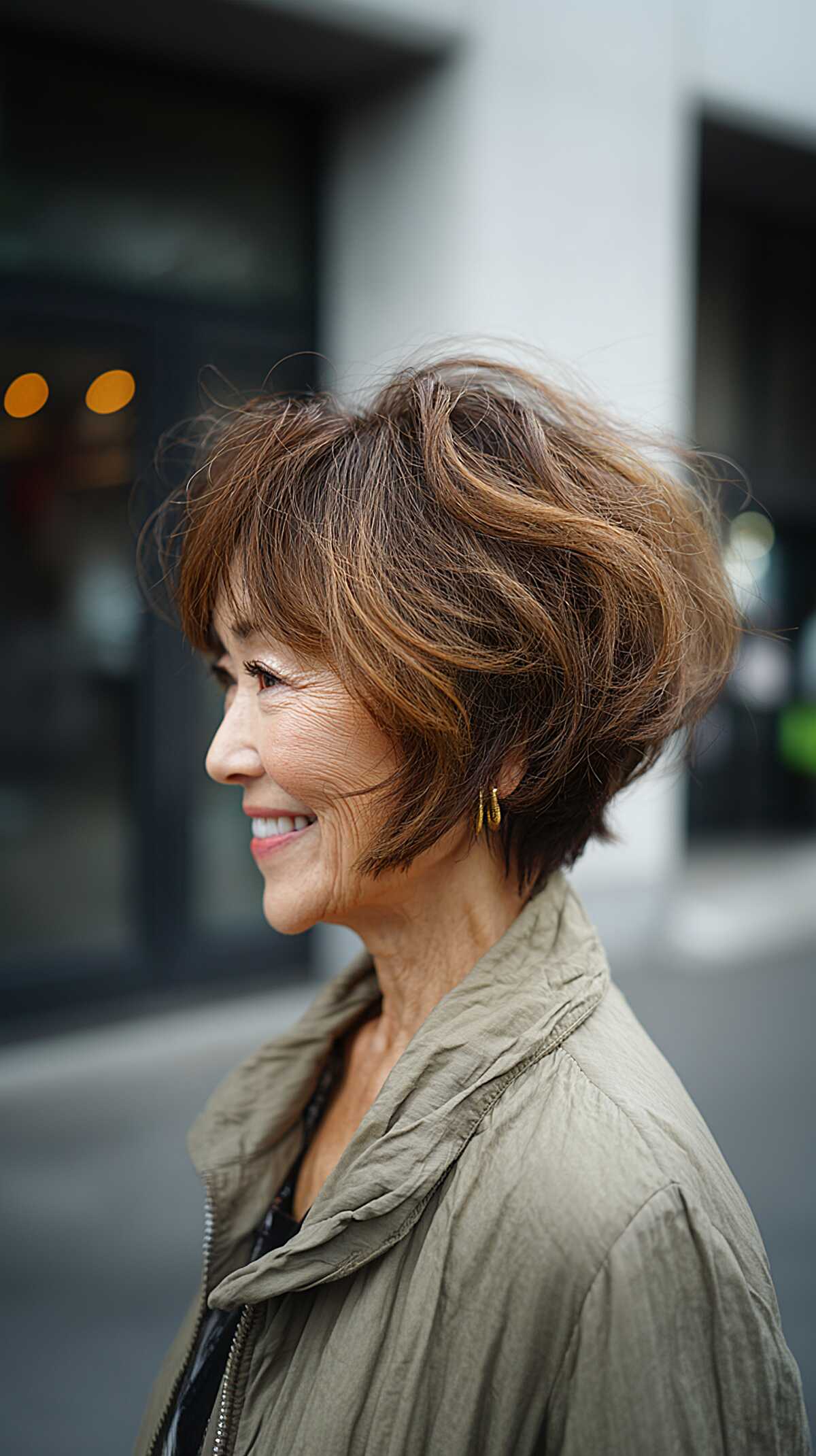 Tousled brown angled bob with caramel highlights