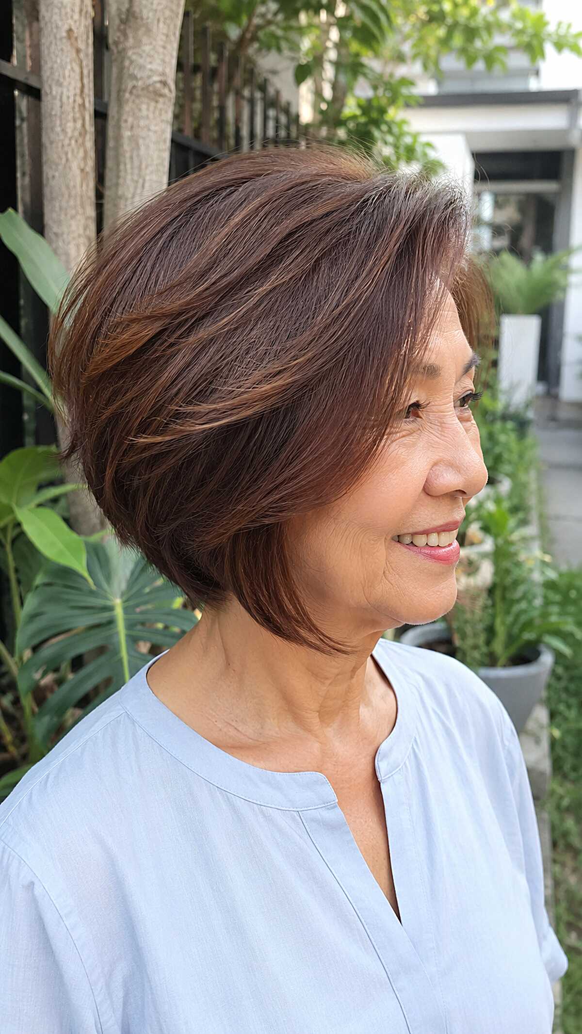 Warm brown layered angled bob with gentle volume