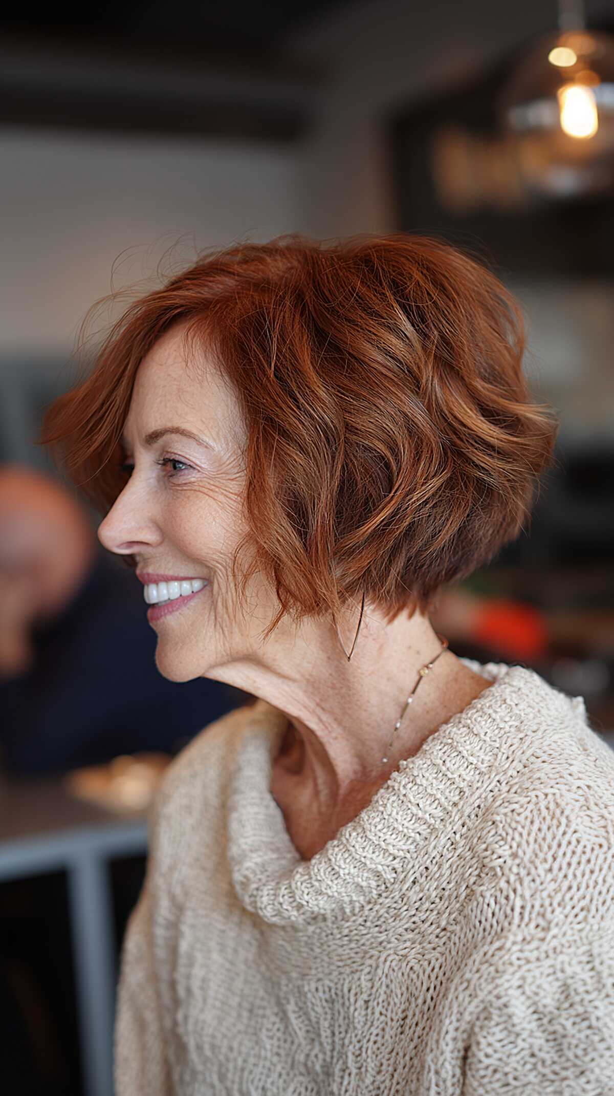 Wavy auburn red textured angled bob with movement