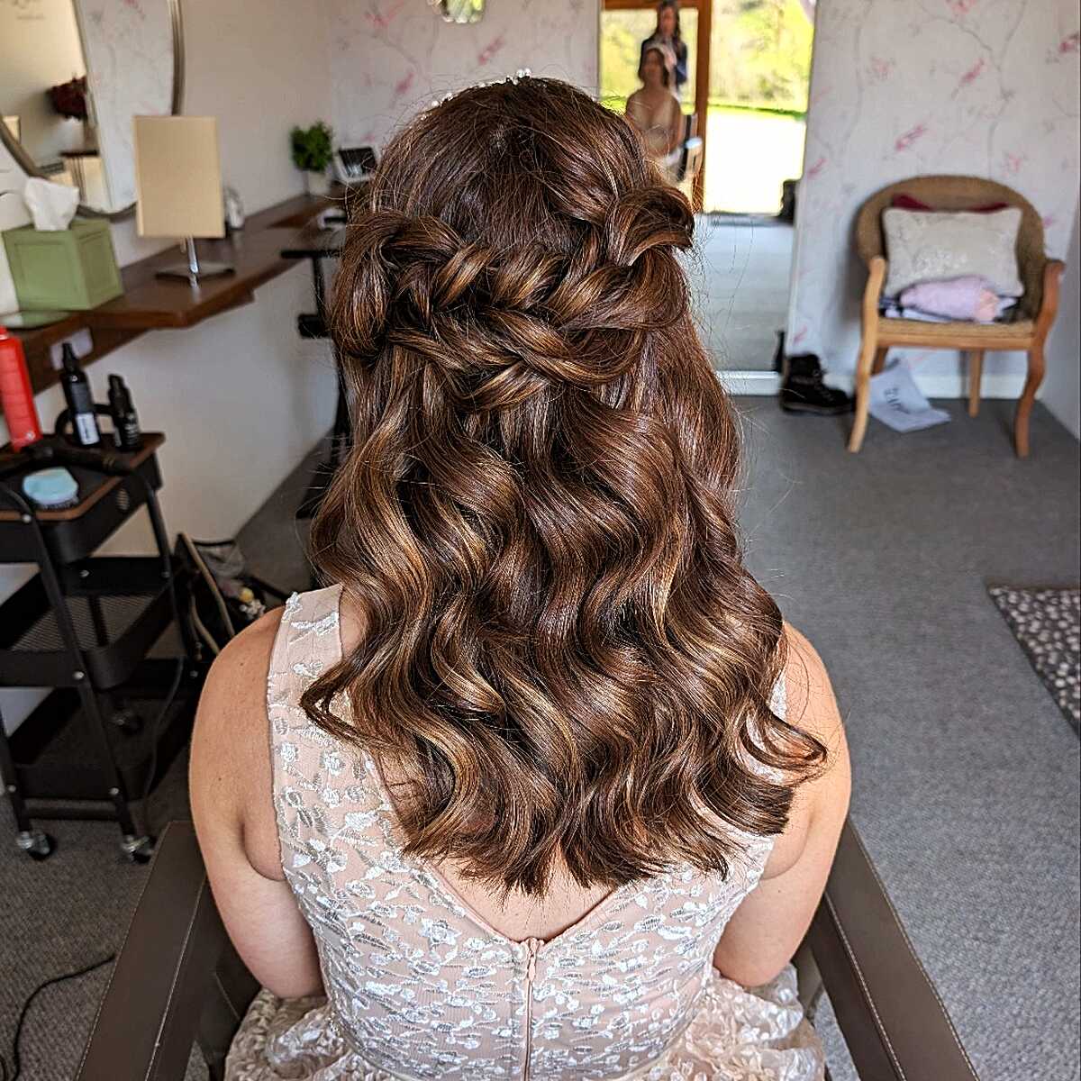 Braided crown half up style with chestnut waves