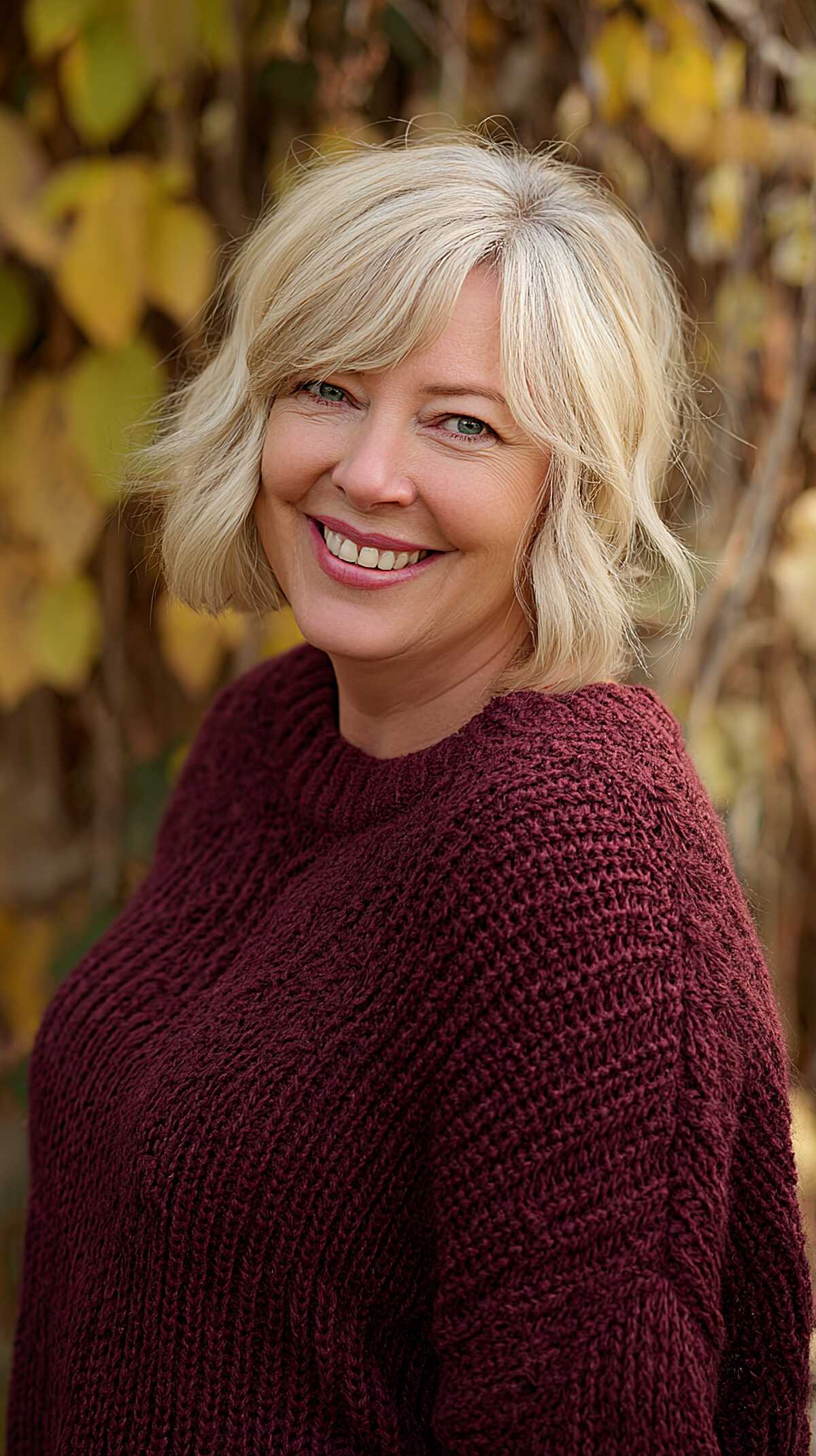Buttery blonde wavy bob with curtain-style layers
