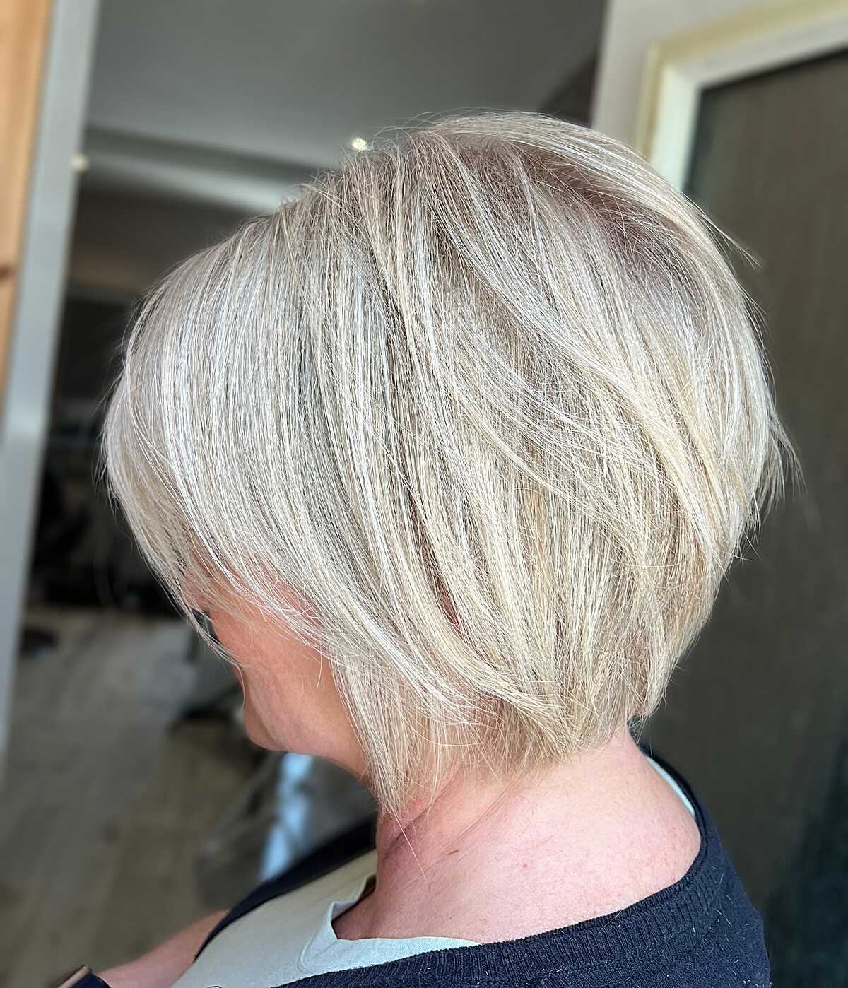 Champagne blonde stacked bixie with textured layers