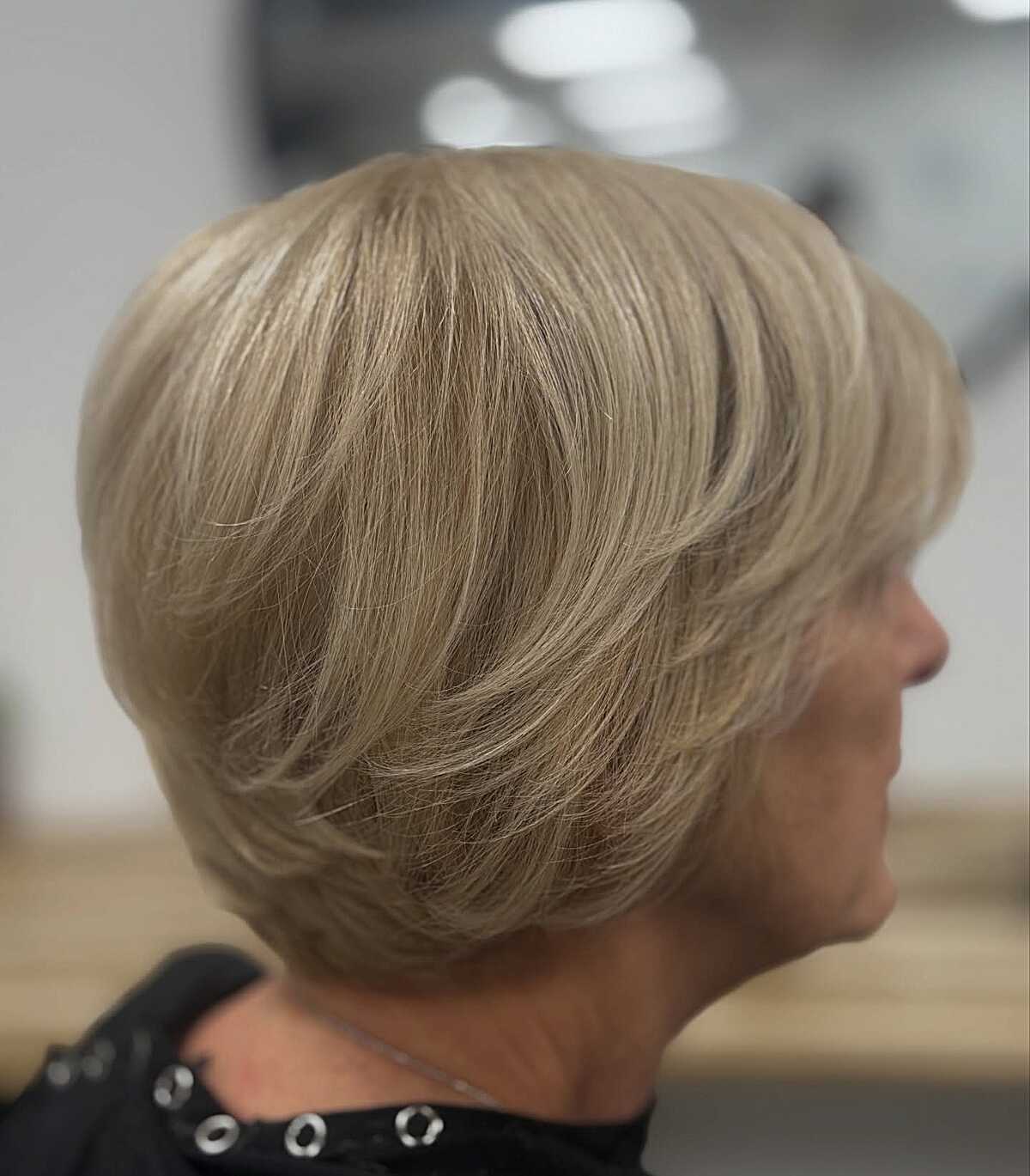 Classic ash blonde bixie with layered crown and tapered nape