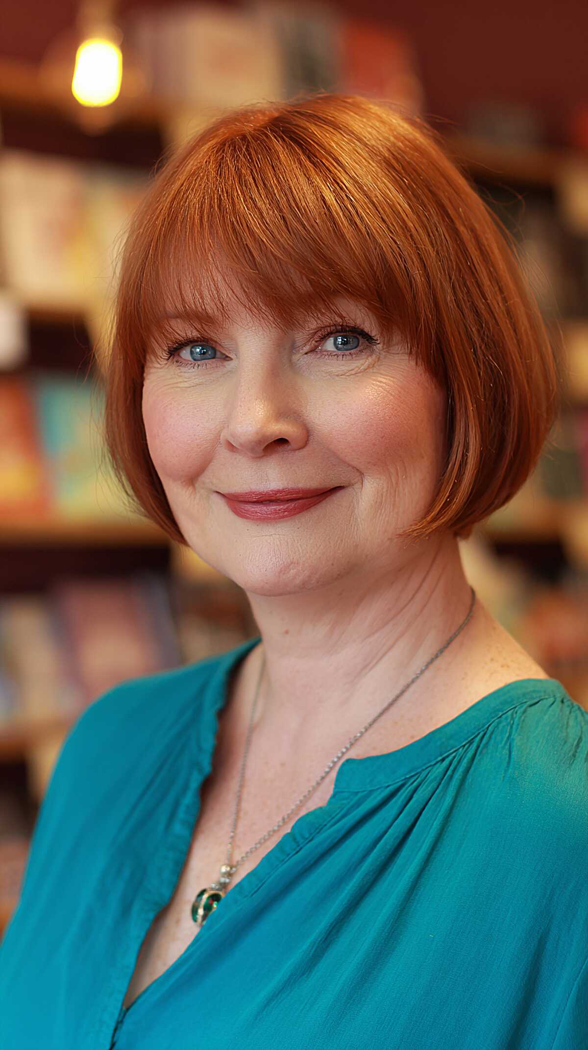 Classic copper red bob with full straight bangs