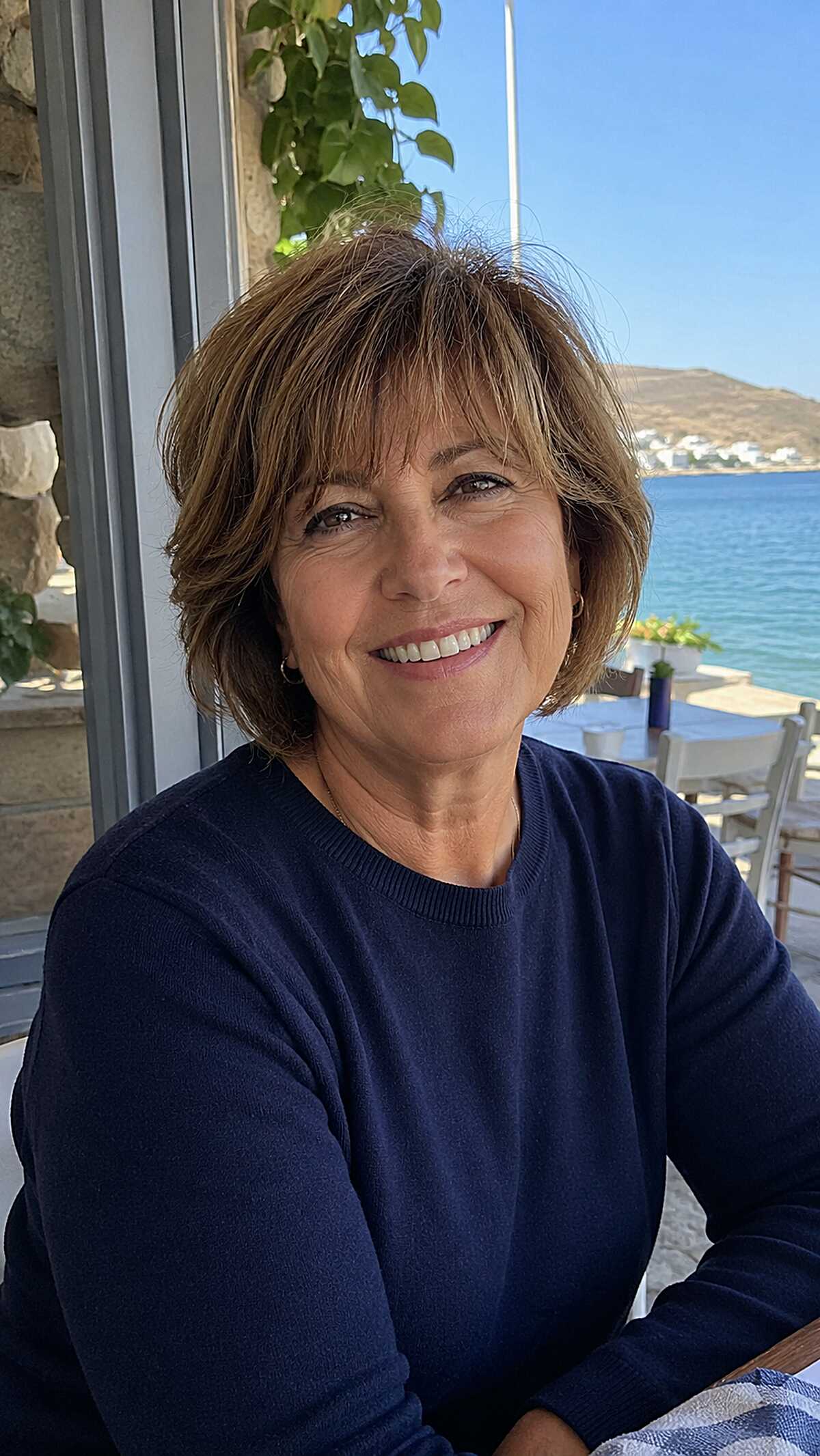 Light brunette feathered choppy bob with wispy fringe