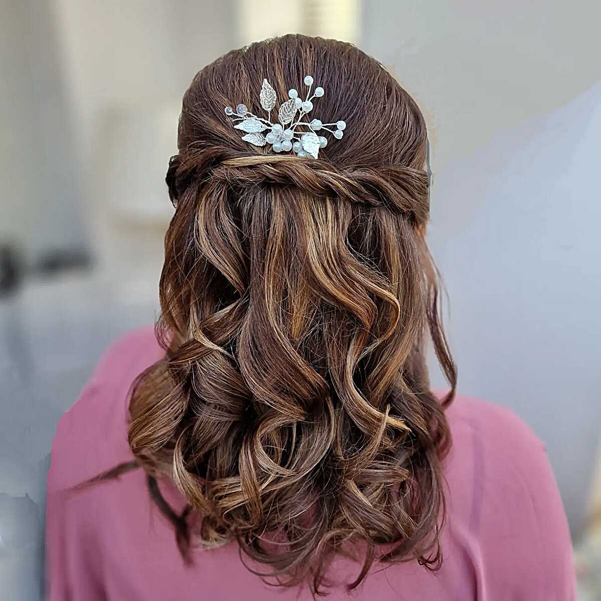 Medium-length half up with crystal leaf hair pin