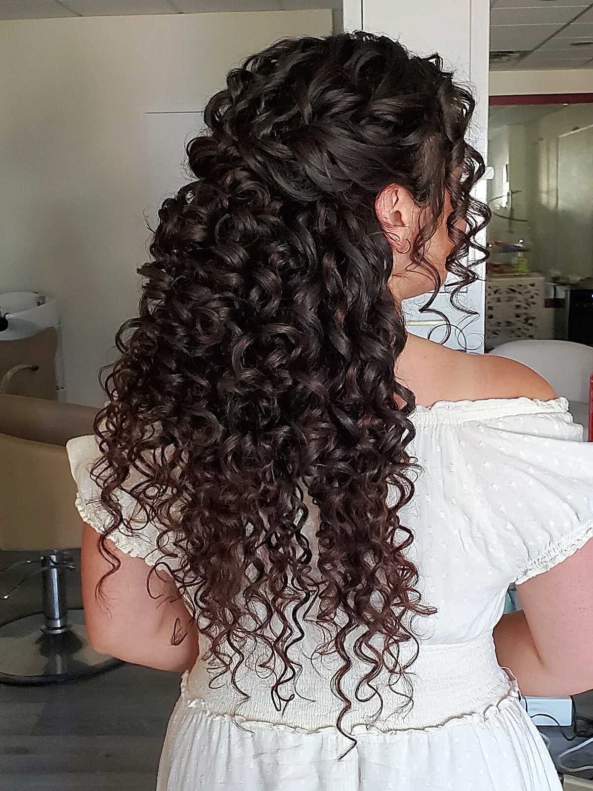 Natural curly hair in a half up wedding style