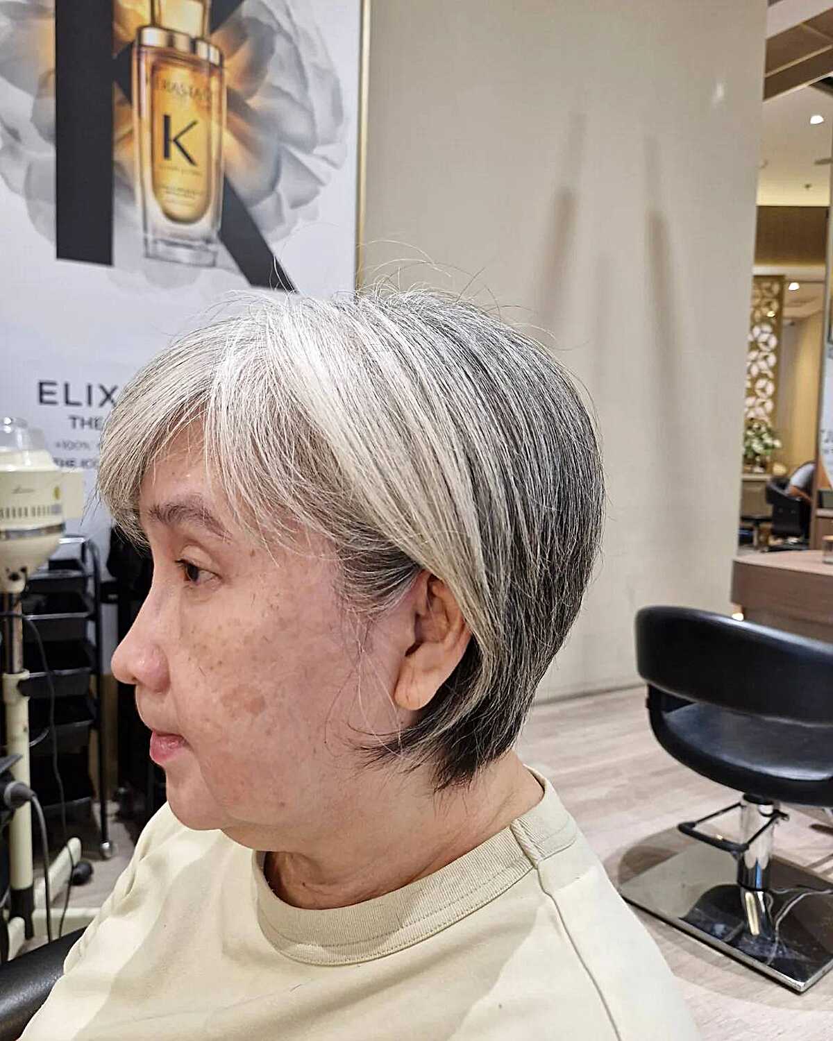 Natural gray and white bixie with wispy ends and side part