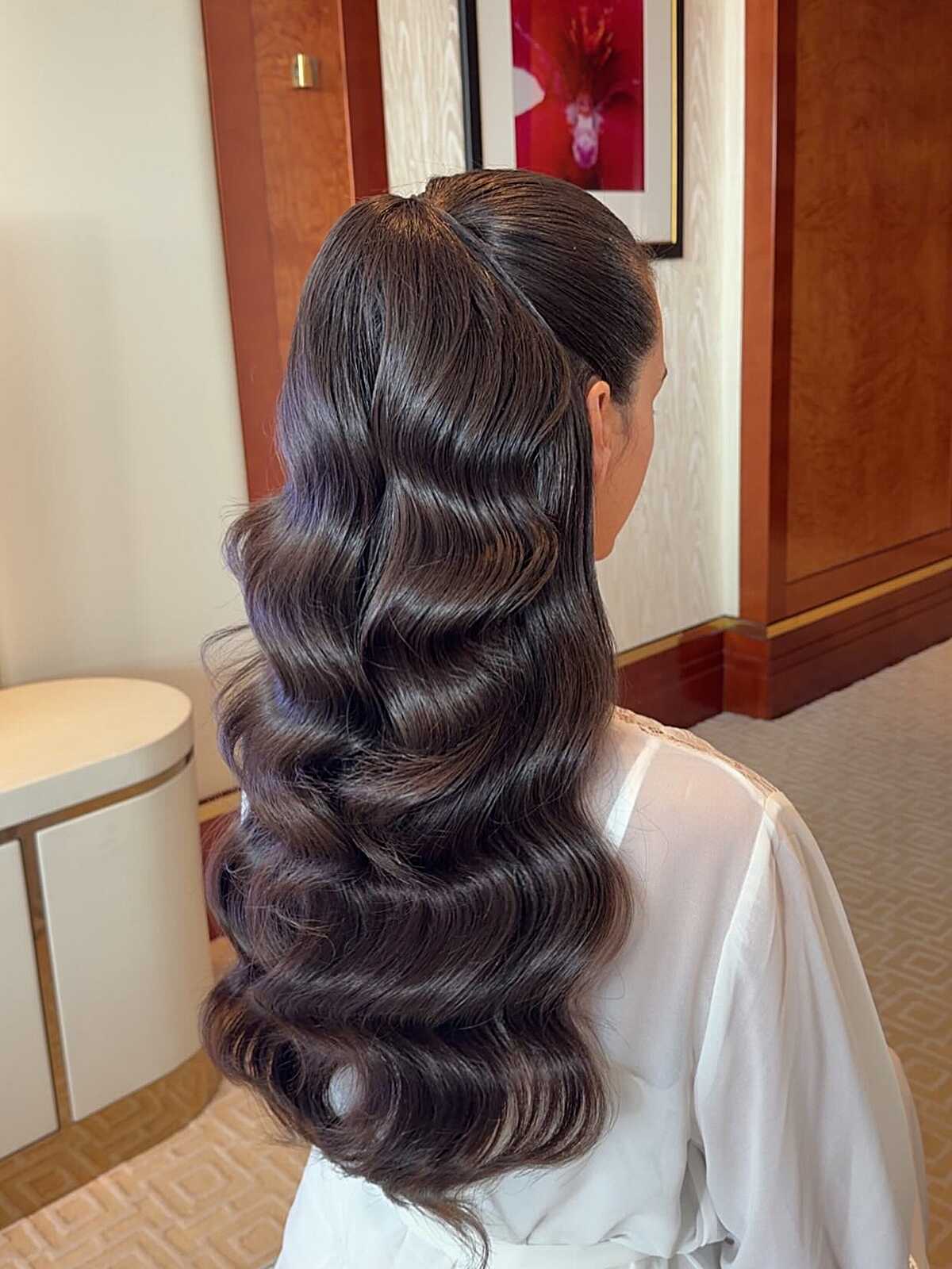 Sleek dark hair with old Hollywood finger waves