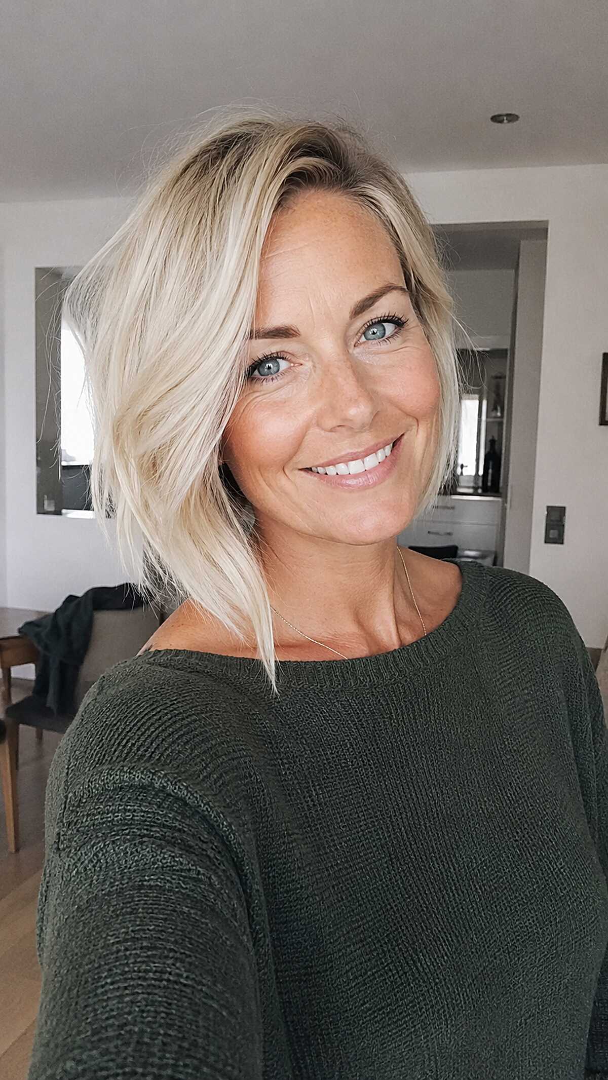 Platinum blonde wavy asymmetrical lob