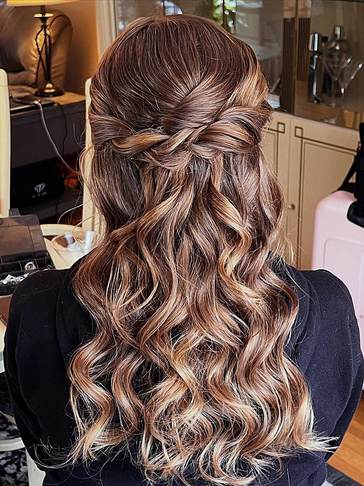 Relaxed brunette half up twist with blonde highlights