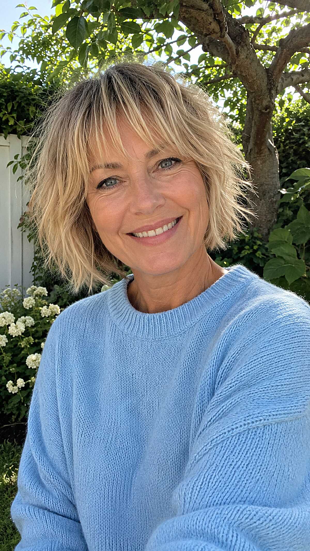 Shaggy blonde chin-length bob with choppy bangs