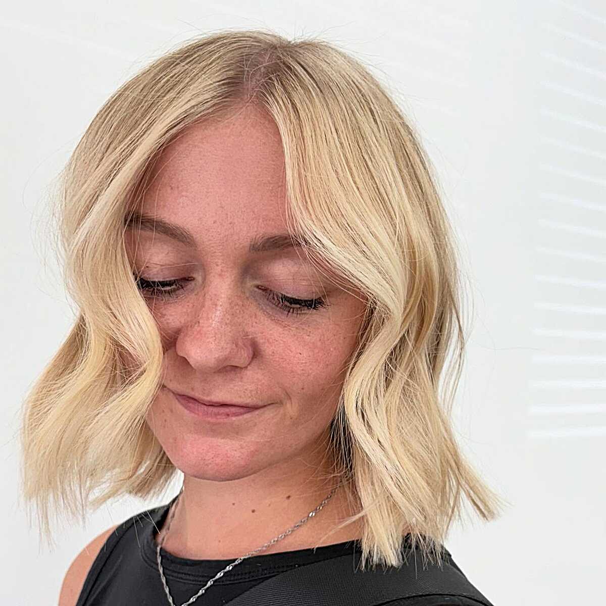 Bright blonde bob with soft textured waves
