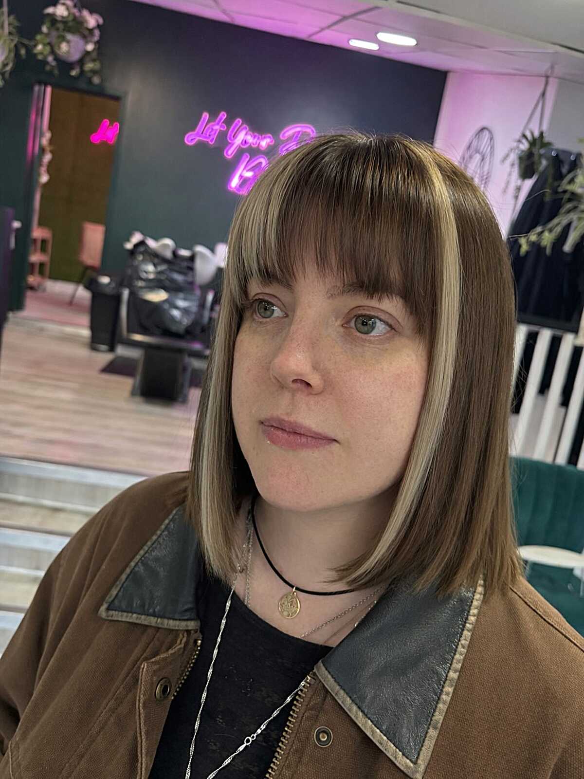 Highlighted blunt lob with full straight-across bangs