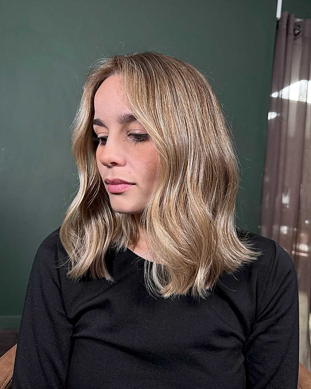 Honey blonde lob with soft waves and blunt ends