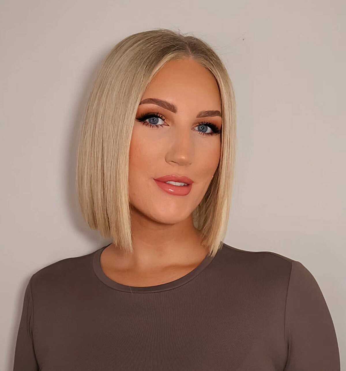 Platinum blonde blunt bob with sharp clean perimeter