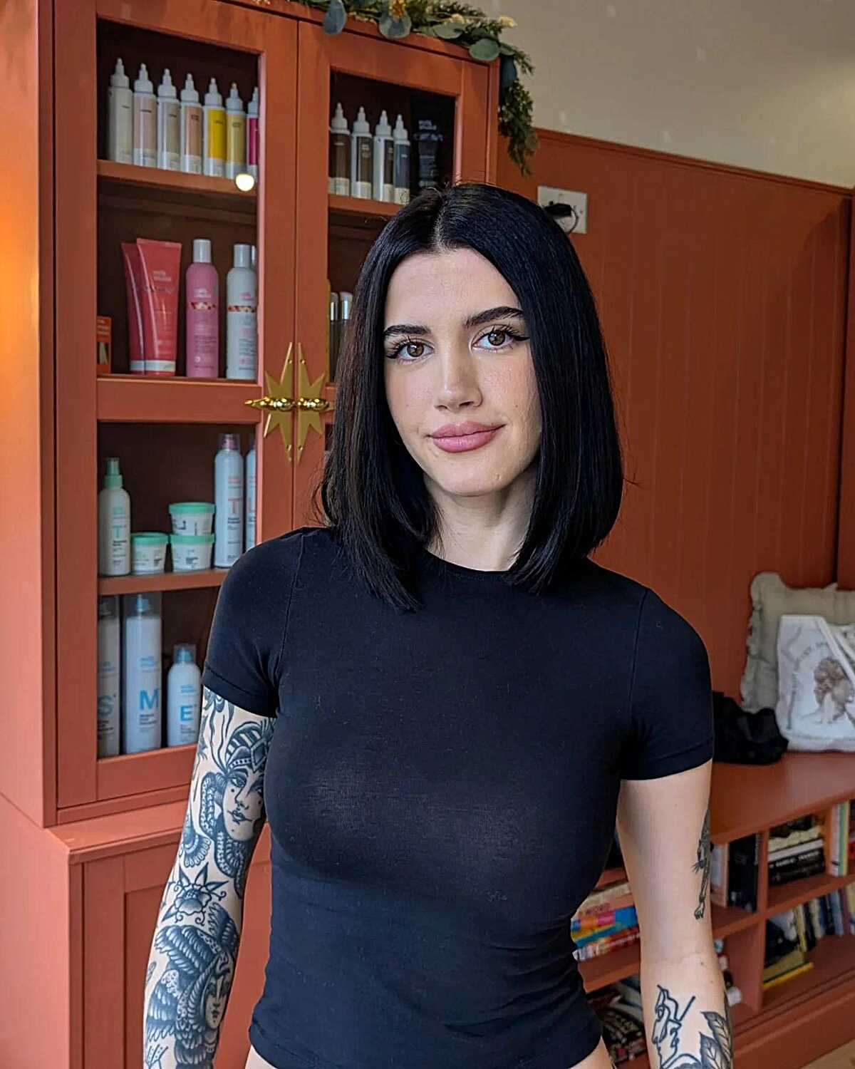 Jet black straight blunt lob hitting the collarbone
