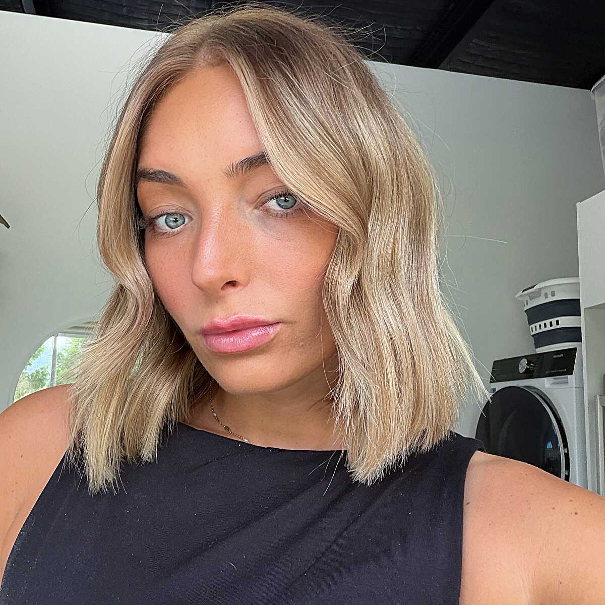 Warm blonde soft blunt lob with tousled texture