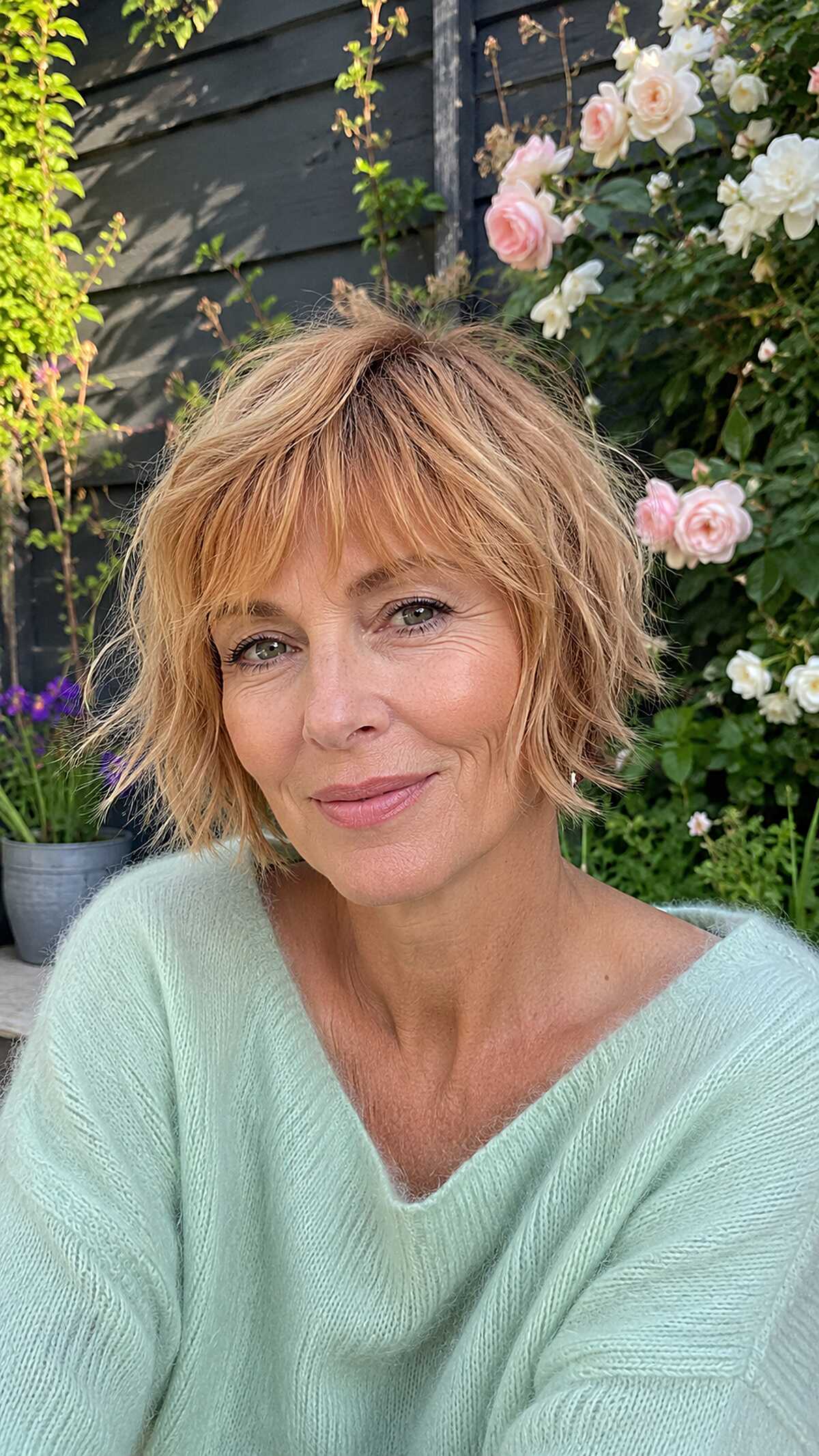 Strawberry blonde shaggy bob with textured bangs