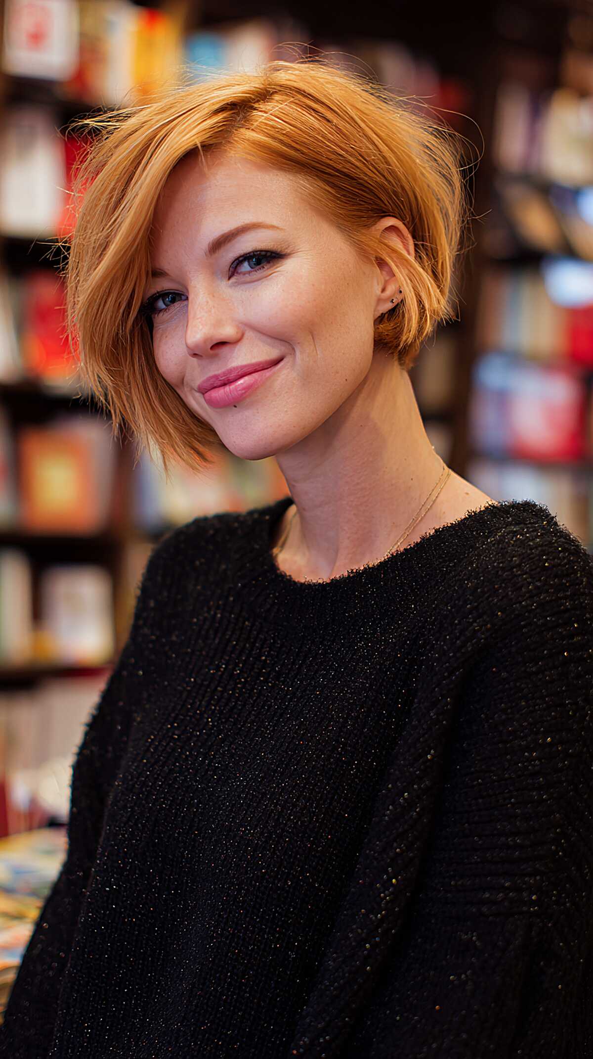 Tousled strawberry blonde asymmetrical bob