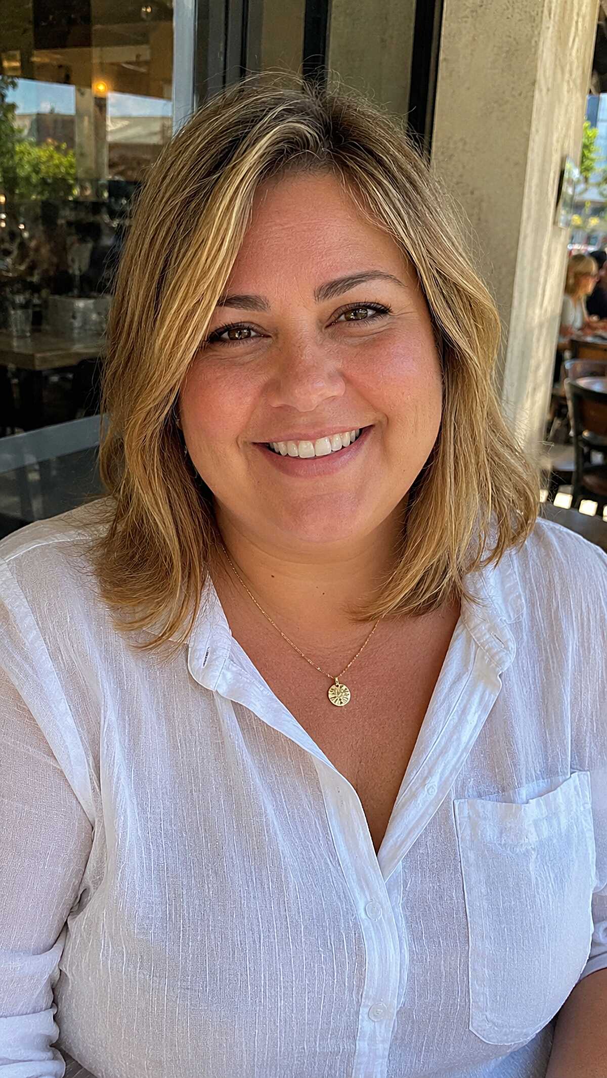 Blonde highlighted layered lob with side part